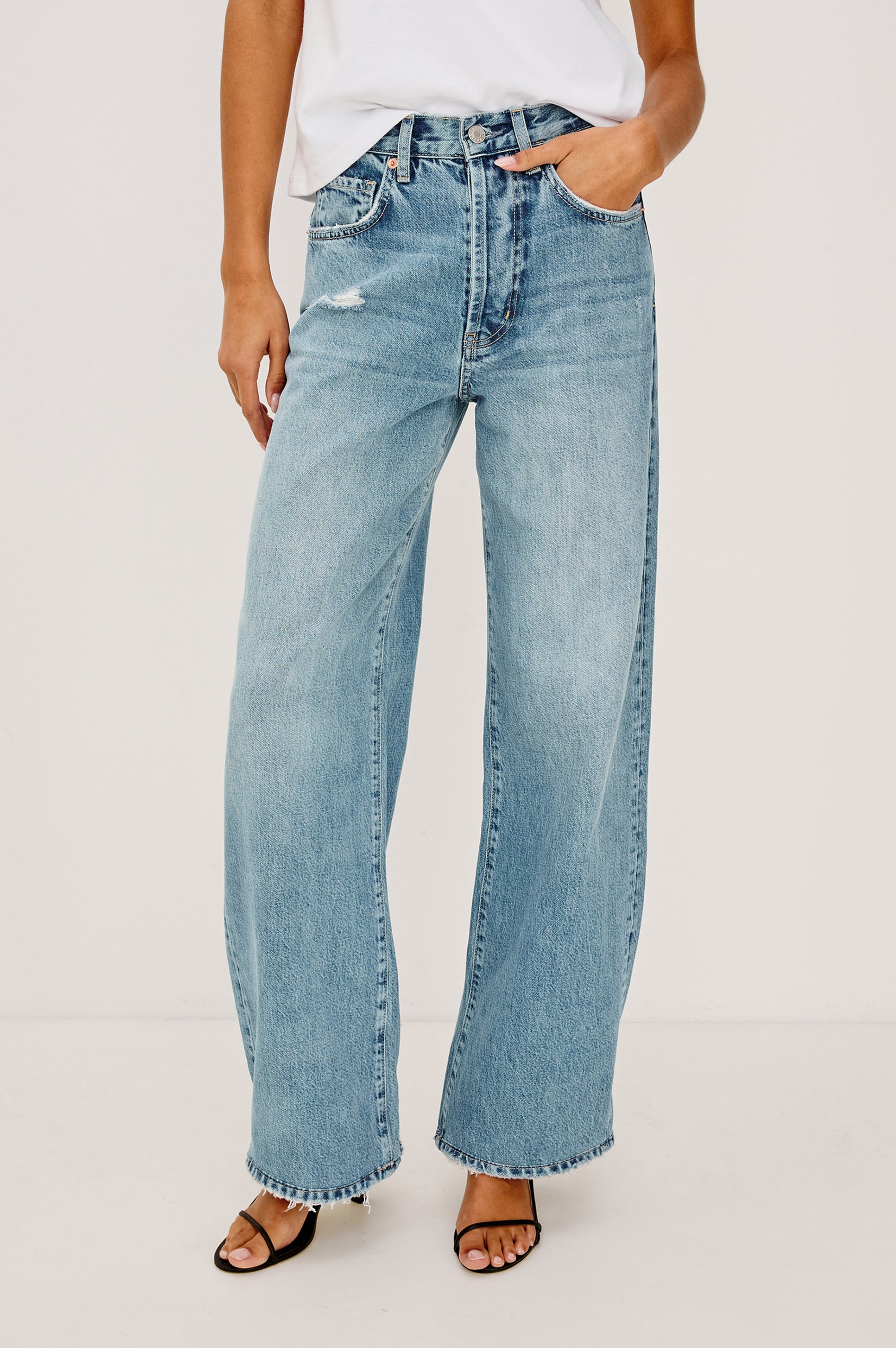 Belmont Arc Leg Jean in Rigid Denim With High-Waisted Fit, Button Fly, and 32″ Inseam in Authentic Stone Colorway - Lower Body Front View Featured on Model
