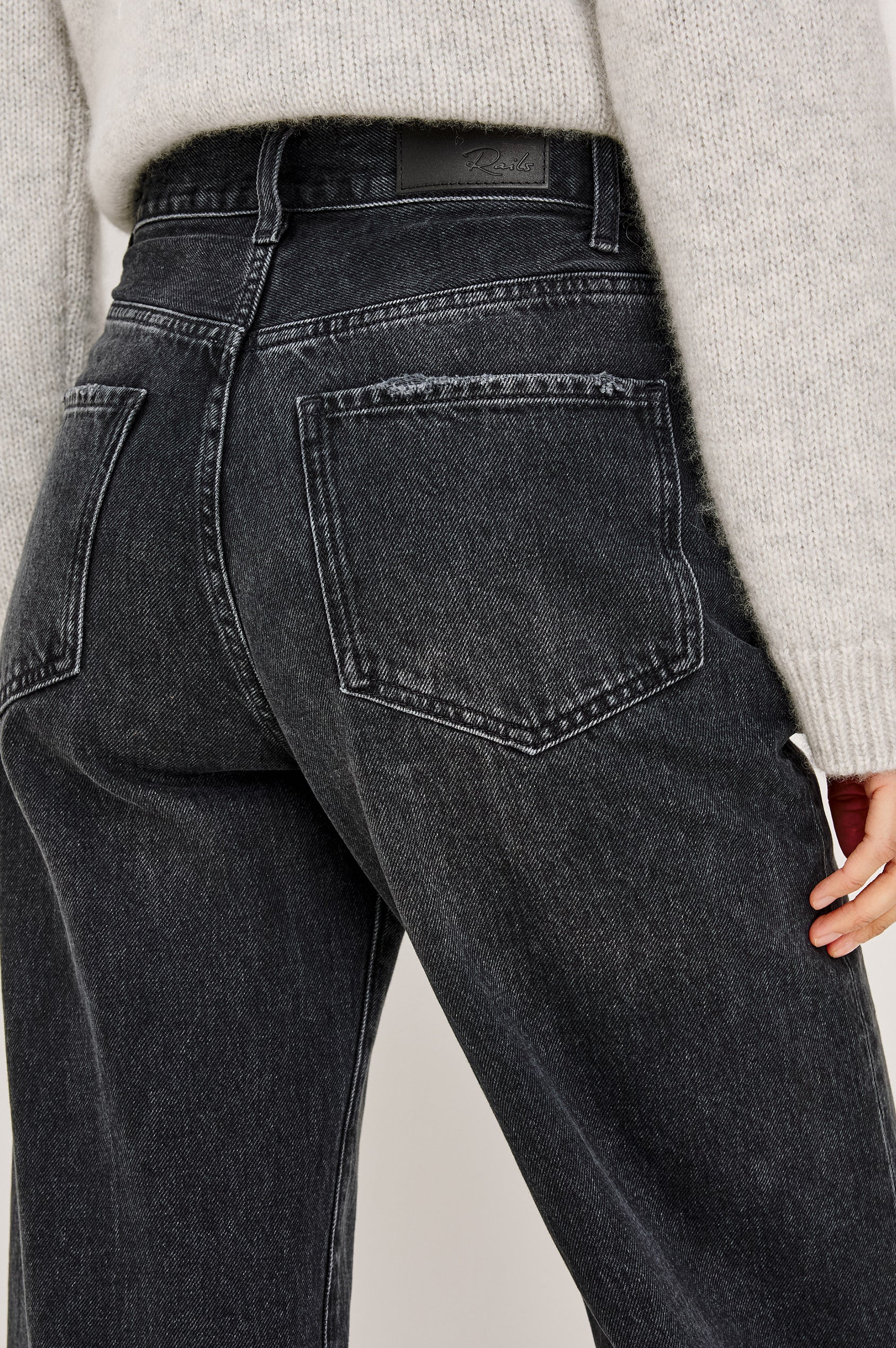Belmont Arc Leg Jean in Rigid Denim With High Rise, Distressed Detailing, Button Fly, and 5-Pockets in Night Cap Colorway - Lower Body Back View Featured on Model