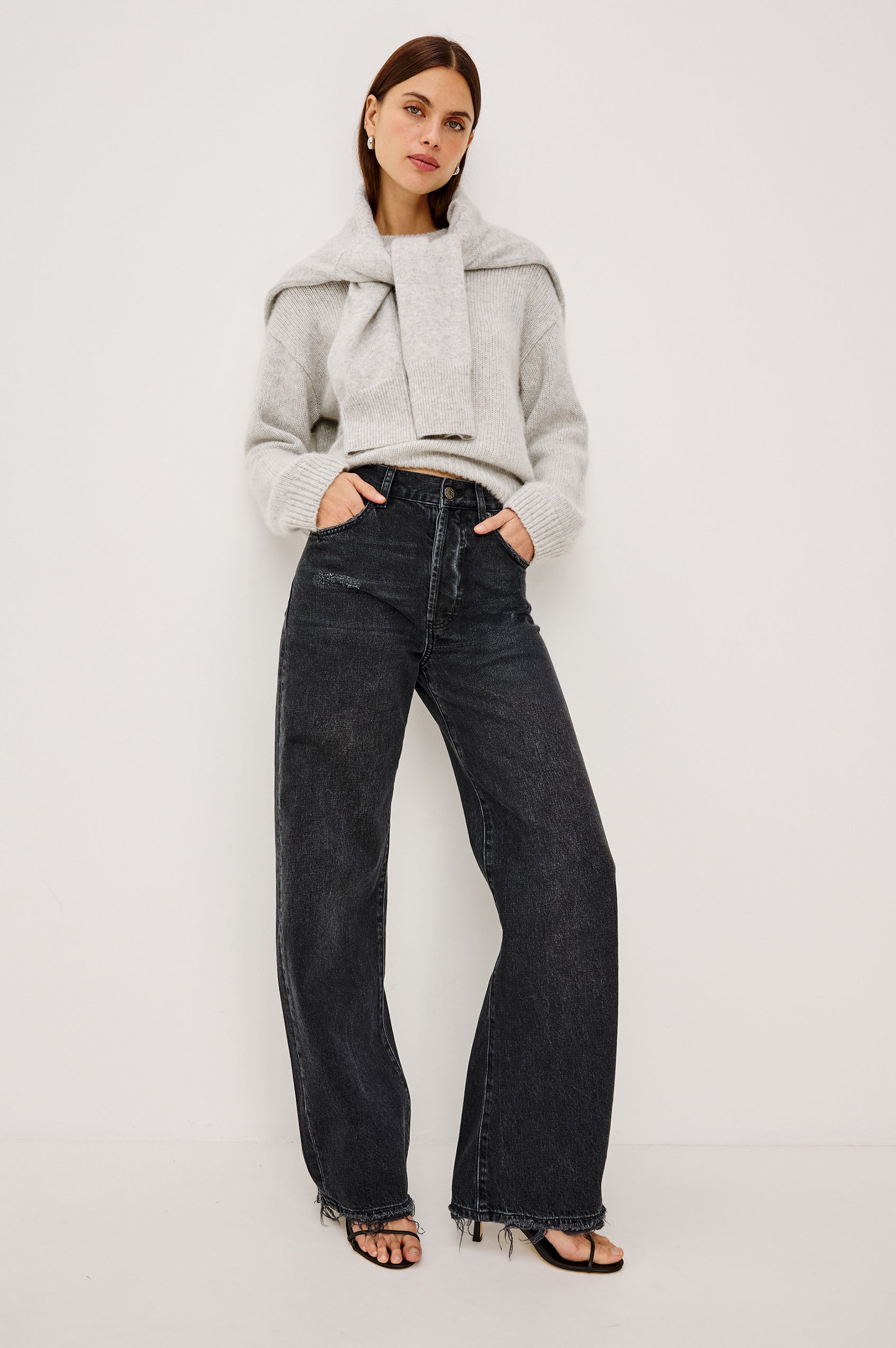 Belmont Arc Leg Jean in Rigid Denim With High Rise, Distressed Detailing, Button Fly, and 5-Pockets in Night Cap Colorway - Full Body Front View Featured on Model