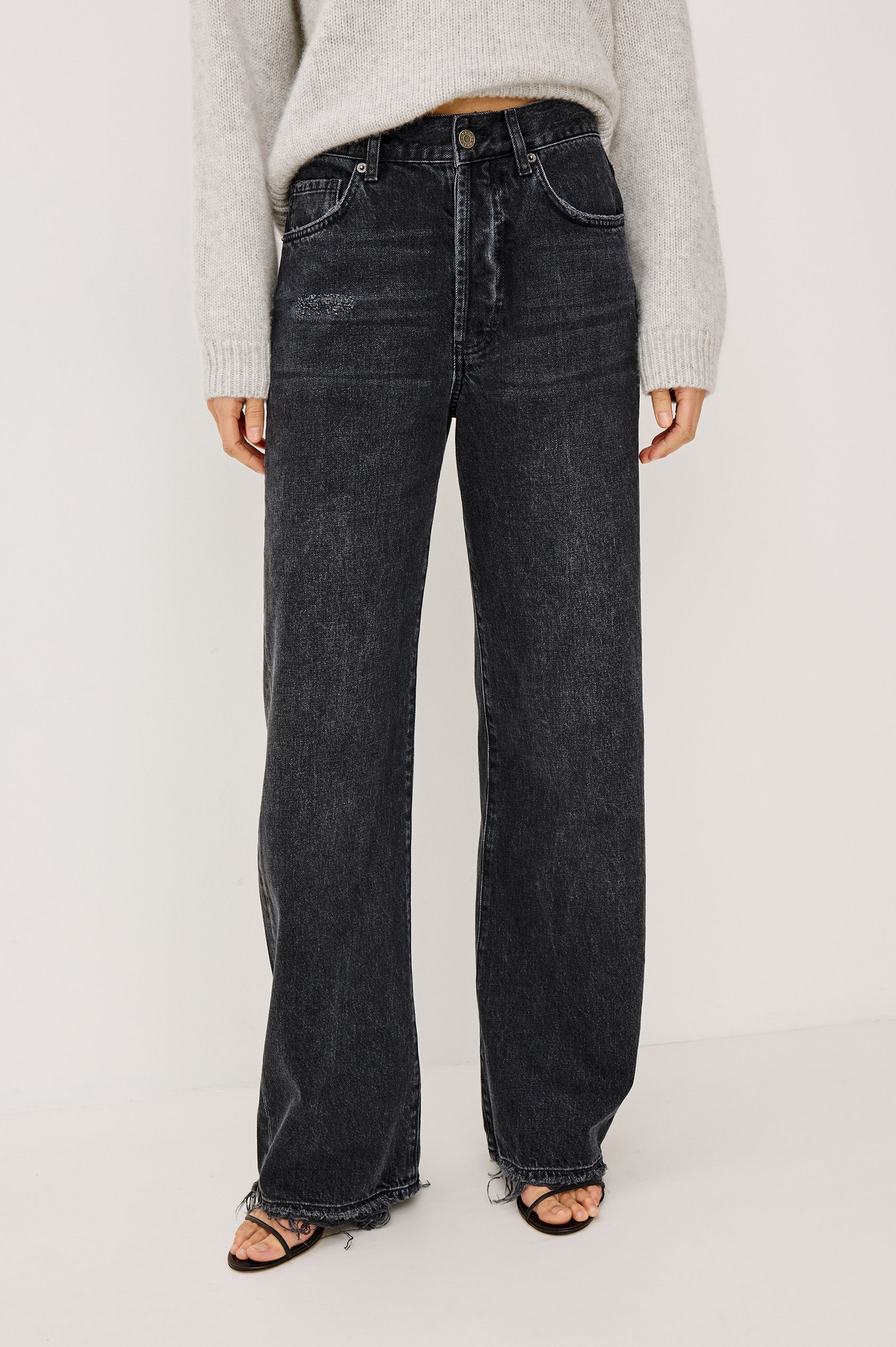 Belmont Arc Leg Jean in Rigid Denim With High Rise, Distressed Detailing, Button Fly, and 5-Pockets in Night Cap Colorway - Lower Body Front View Featured on Model