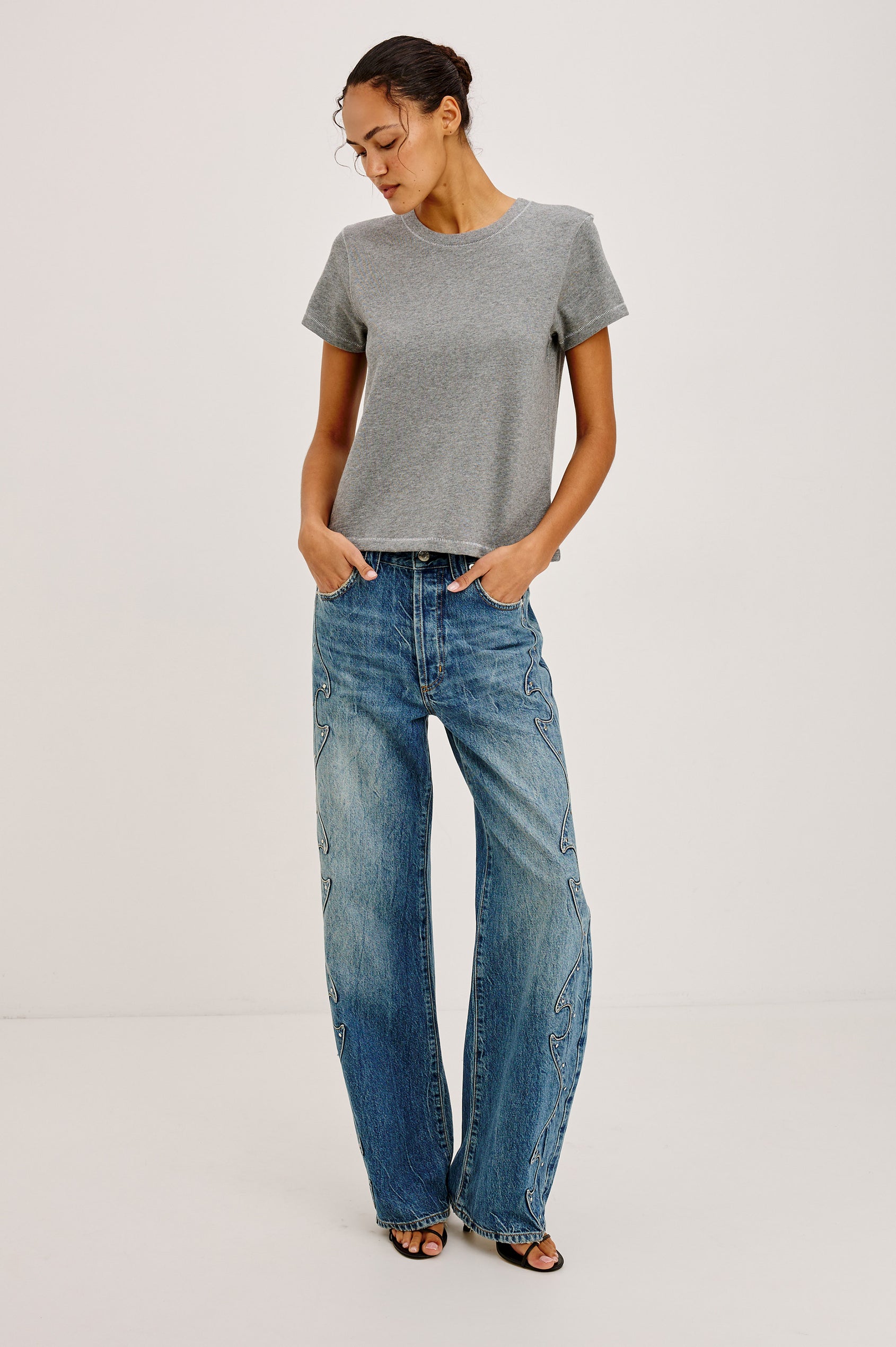Belmont Arc Leg Jean in Rigid Denim With High Rise, Western Side Seam and Stud Detailing, Button Fly, and Side and Back Pockets in Night Cap Colorway - Full Body Front View Featured on Model
