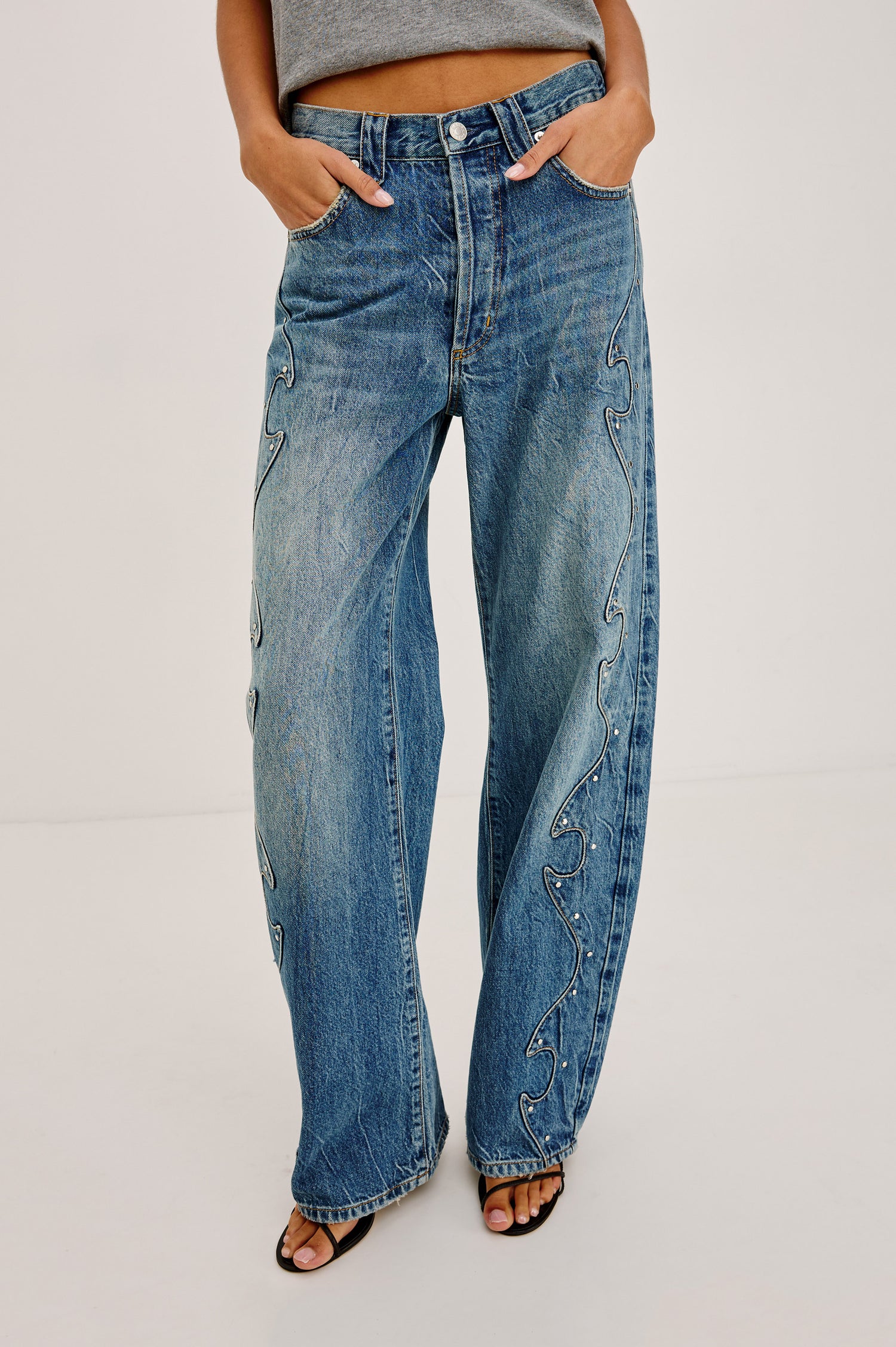Belmont Arc Leg Jean in Rigid Denim With High Rise, Western Side Seam and Stud Detailing, Button Fly, and Side and Back Pockets in Night Cap Colorway - Lower Body Front View Featured on Model