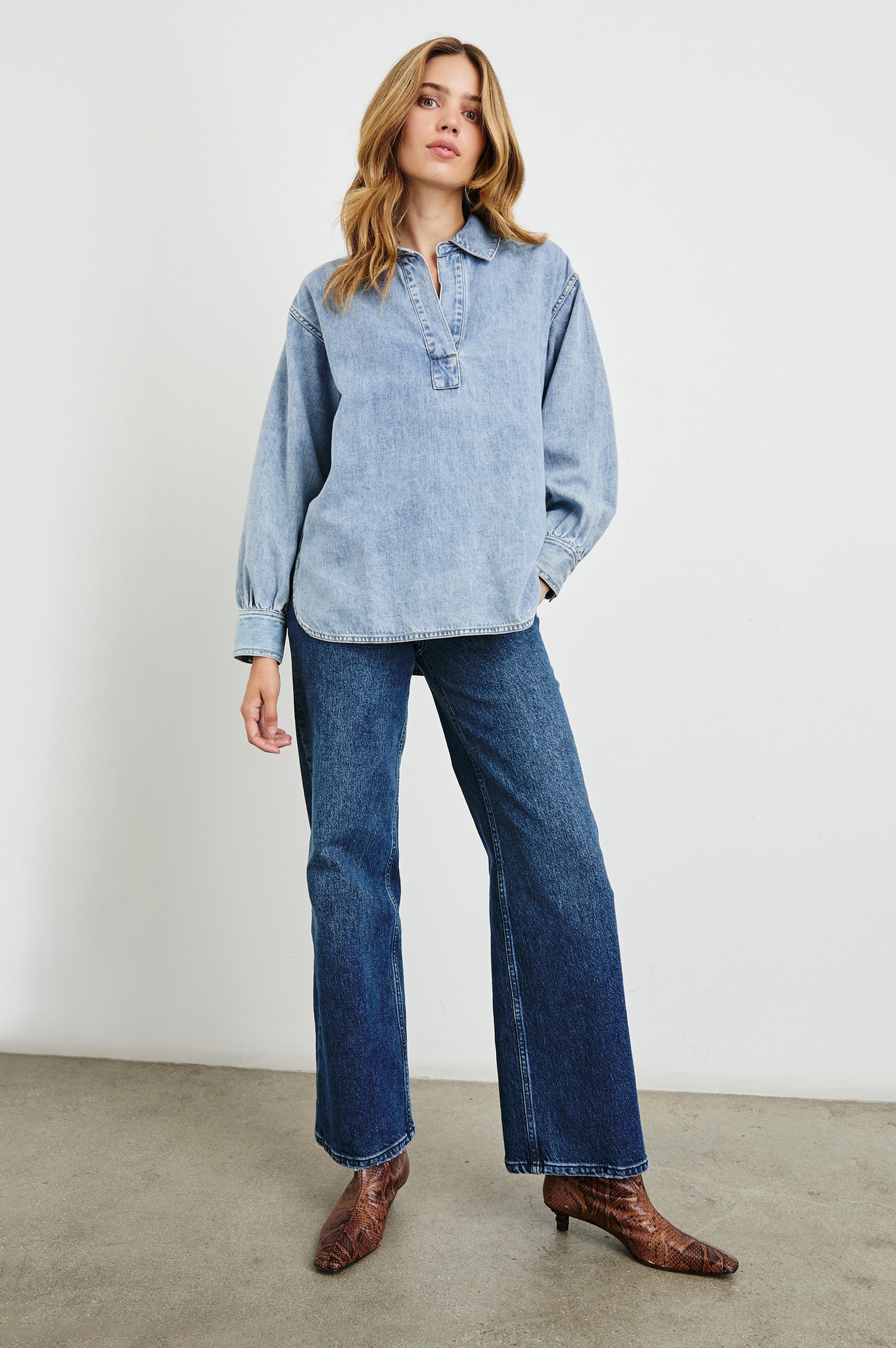 Bennett Denim Long-Sleeve Shirt with a Placket V Neck, a Collar, and Snap Cuffs in Faded Indigo Colorway - Front Full Body View Featured on Model 
