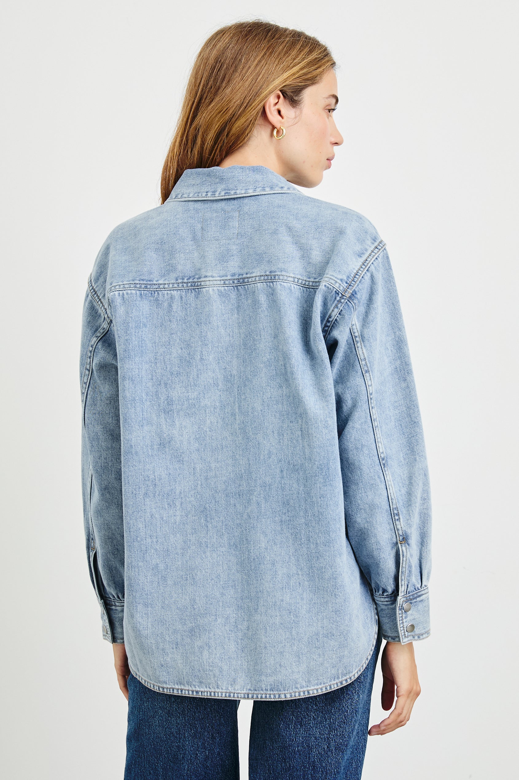 Bennett Denim Long-Sleeve Shirt with a Placket V Neck, a Collar, and Snap Cuffs in Faded Indigo Colorway - Back View Featured on Model 
