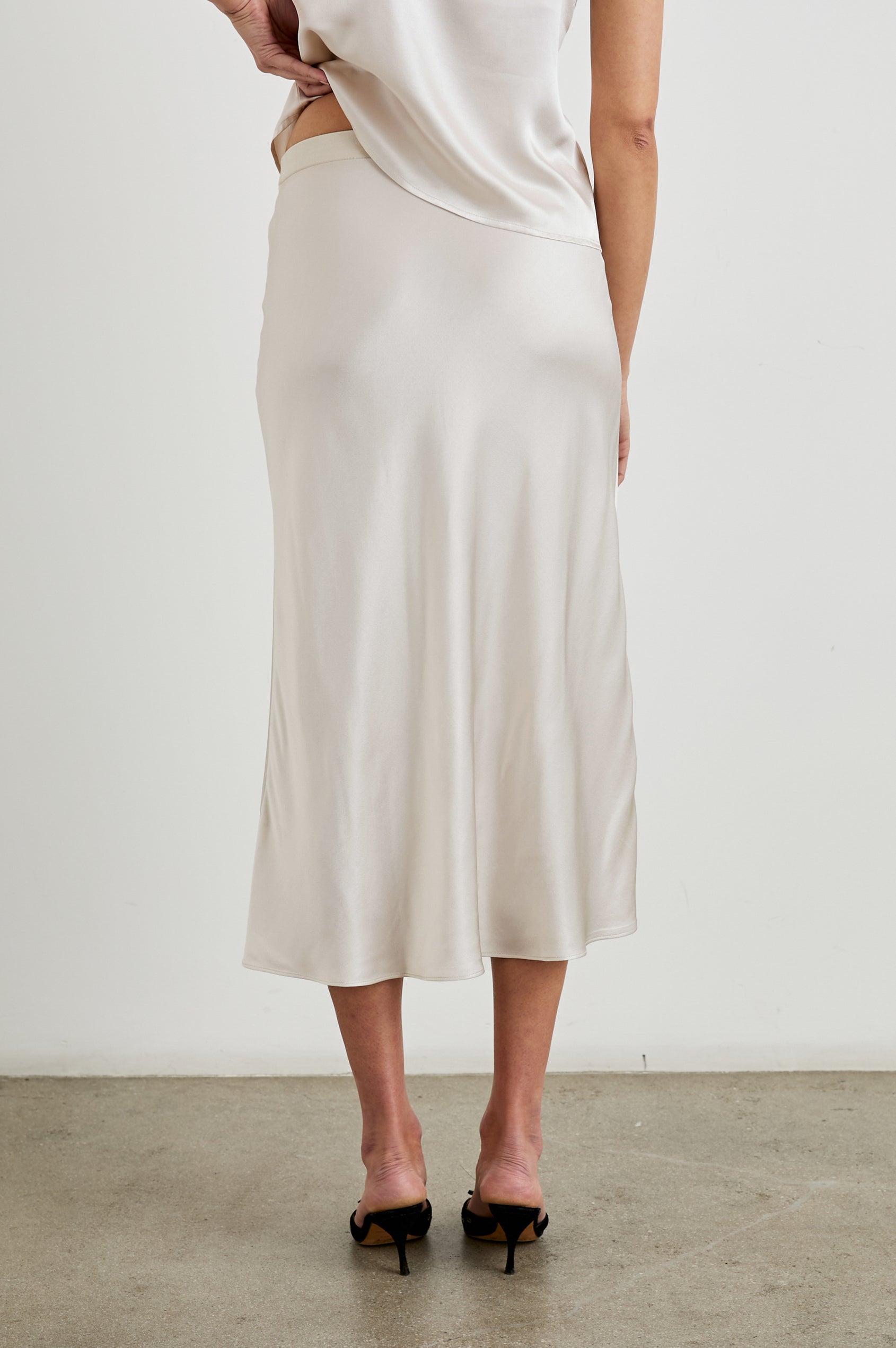 Berlin Midi Skirt in Ivory Colorway - Back View Featured on Model