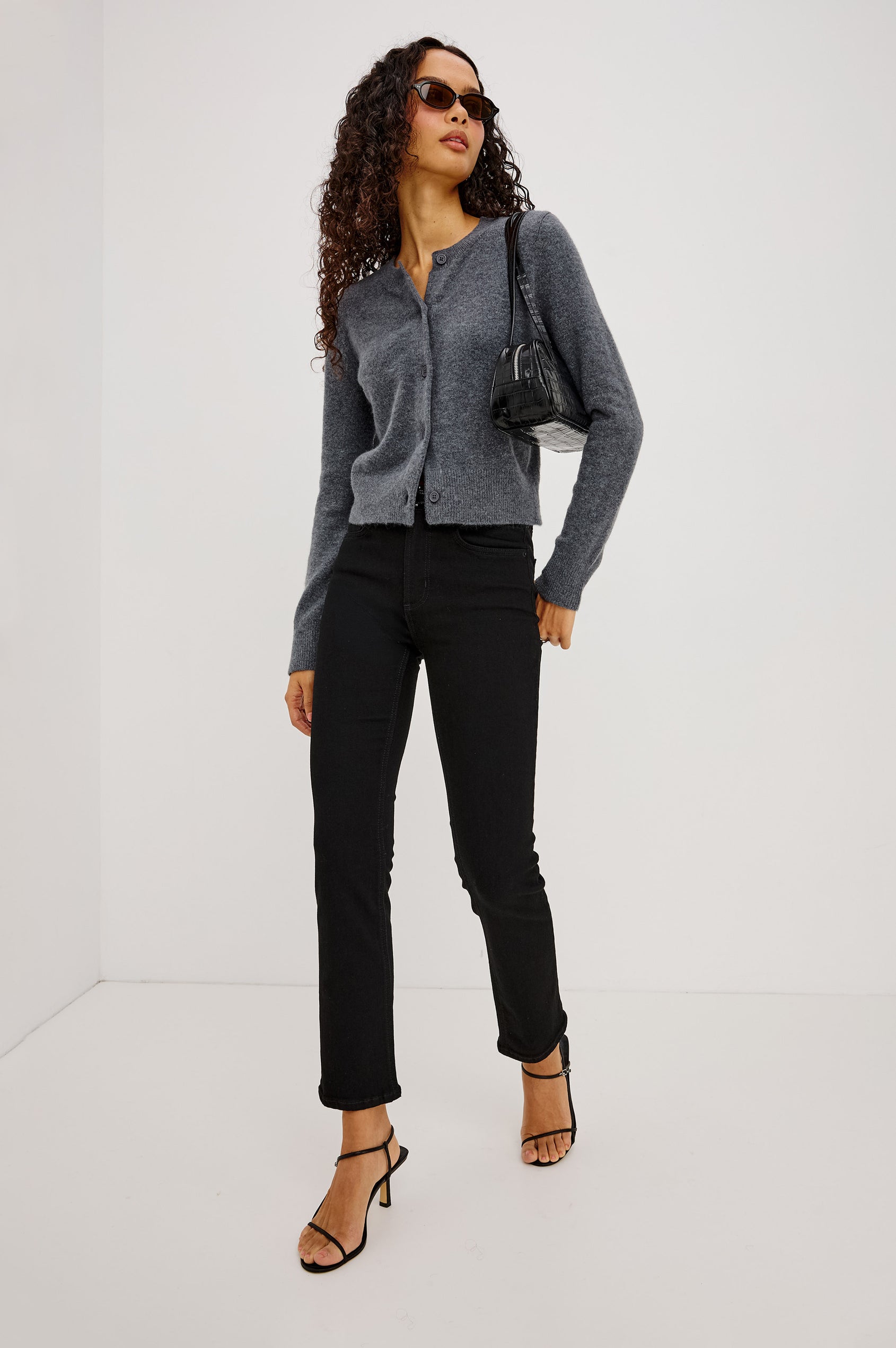 Bixby Slim Jean in High-Stretch Denim With Mid-Rise, Slim Legs, Zip Fly, and Ankle-Length Inseam in Blackout Colorway - Full Body Front View Featured on Model