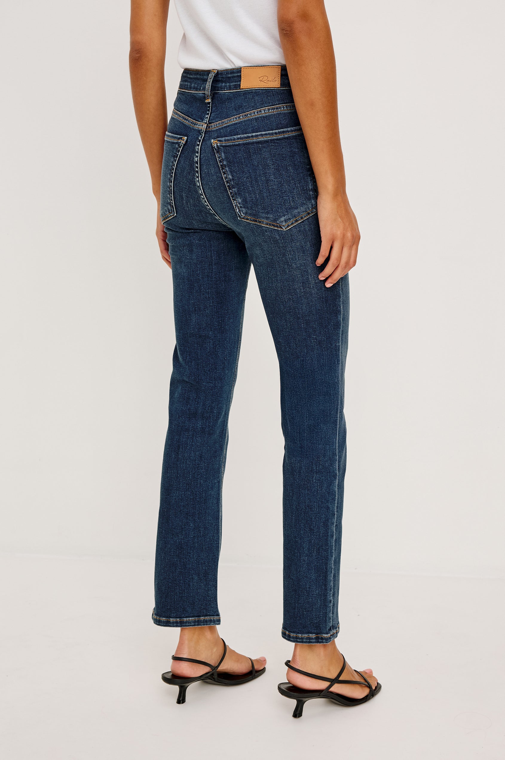 Bixby is a 5-pkt slim straight jean in Deep Dive colorway. Full body back view featured on model.