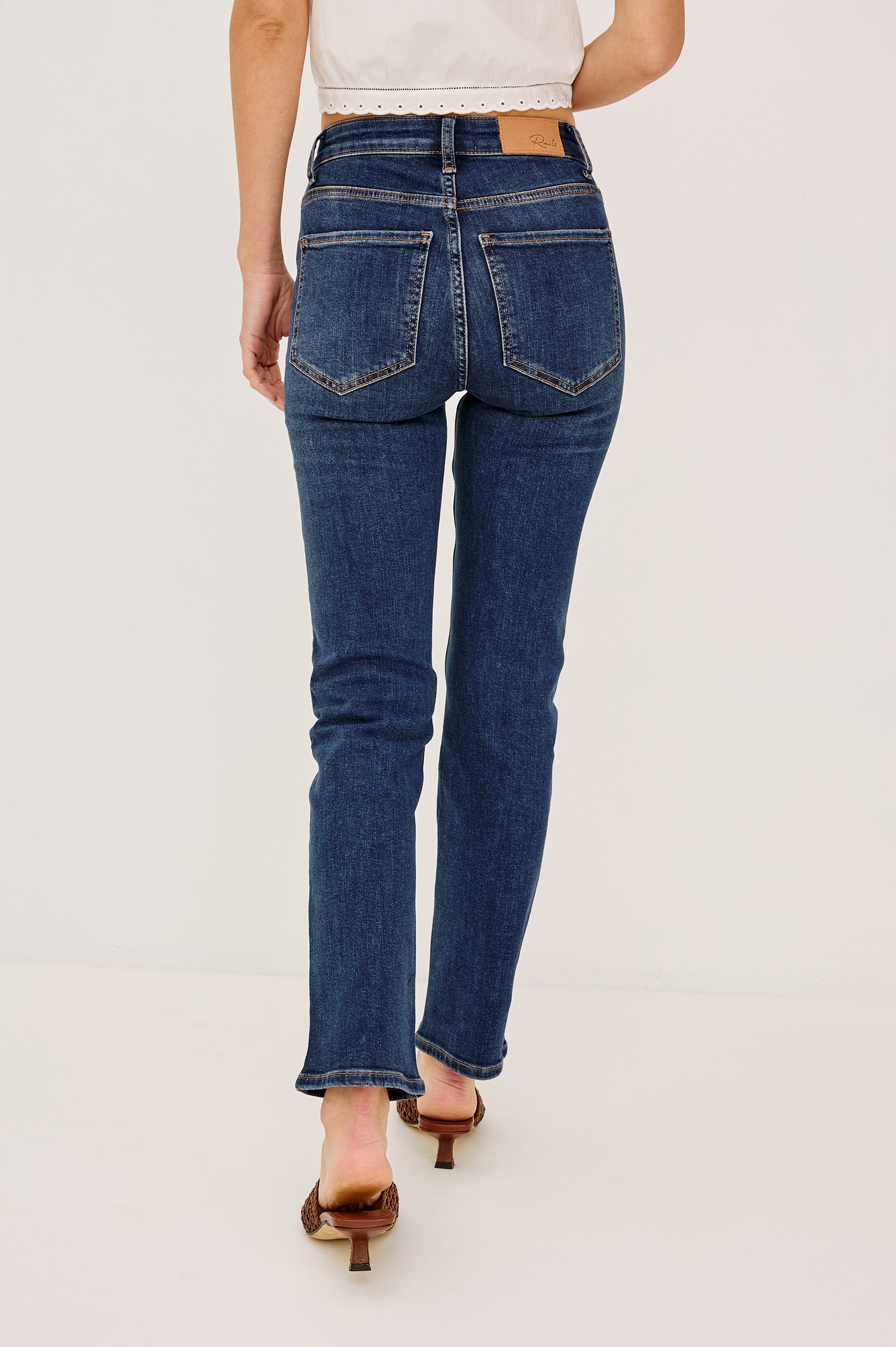 Bixby is a 5-pkt slim straight jean in Deep Dive colorway. Back view featured on model.