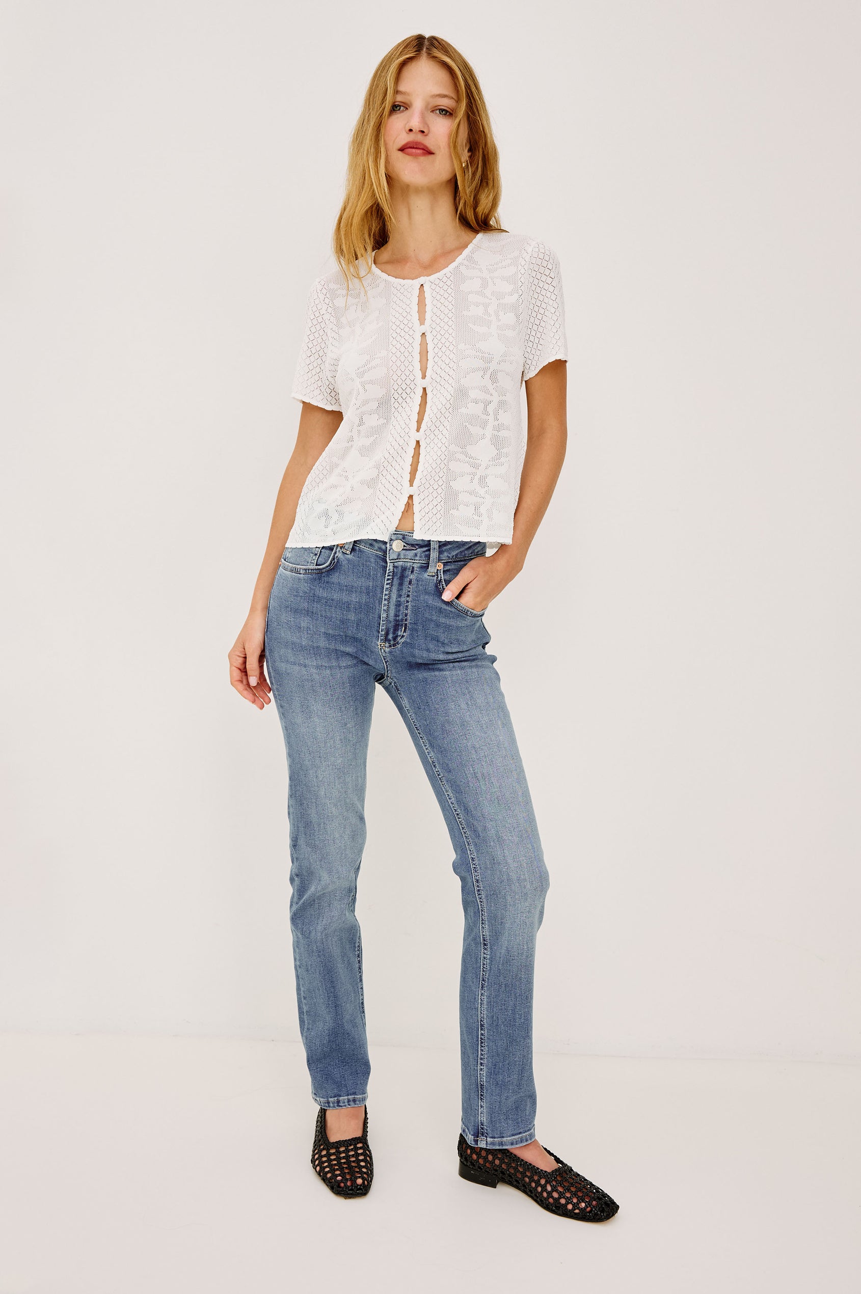 Bixby is a 5-pkt slim straight jean in Vista Blue colorway. Front view featured on model.