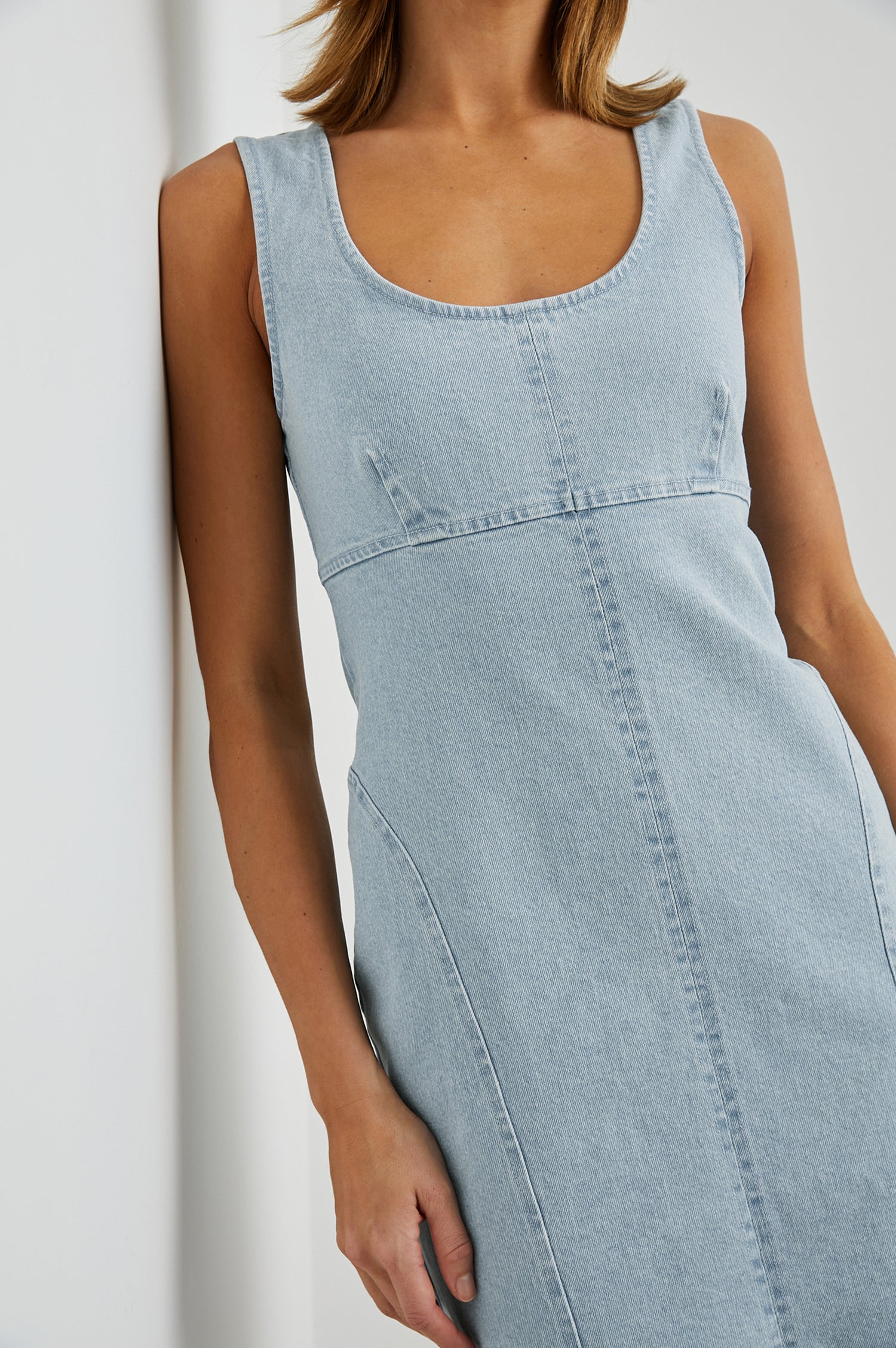 Blaze Denim Sleeveless Mini Dress with a Scoop Neck, Wide Shoulder Straps, a Full Zipper Back Closure, and Additional Seams in Bleach Indigo Colorway - Front View Featured on Model 