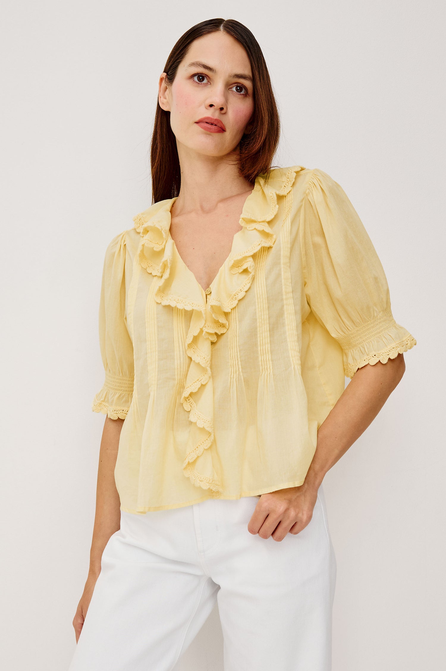 Bloom Poplin Top With Ruffle V-Neckline Elbow-Length Puff Sleeves With Ruffled Cuffs Pintuck Detailing and Boxy Relaxed Fit in Sunshine Colorway - Upper Body Front View Featured on Model