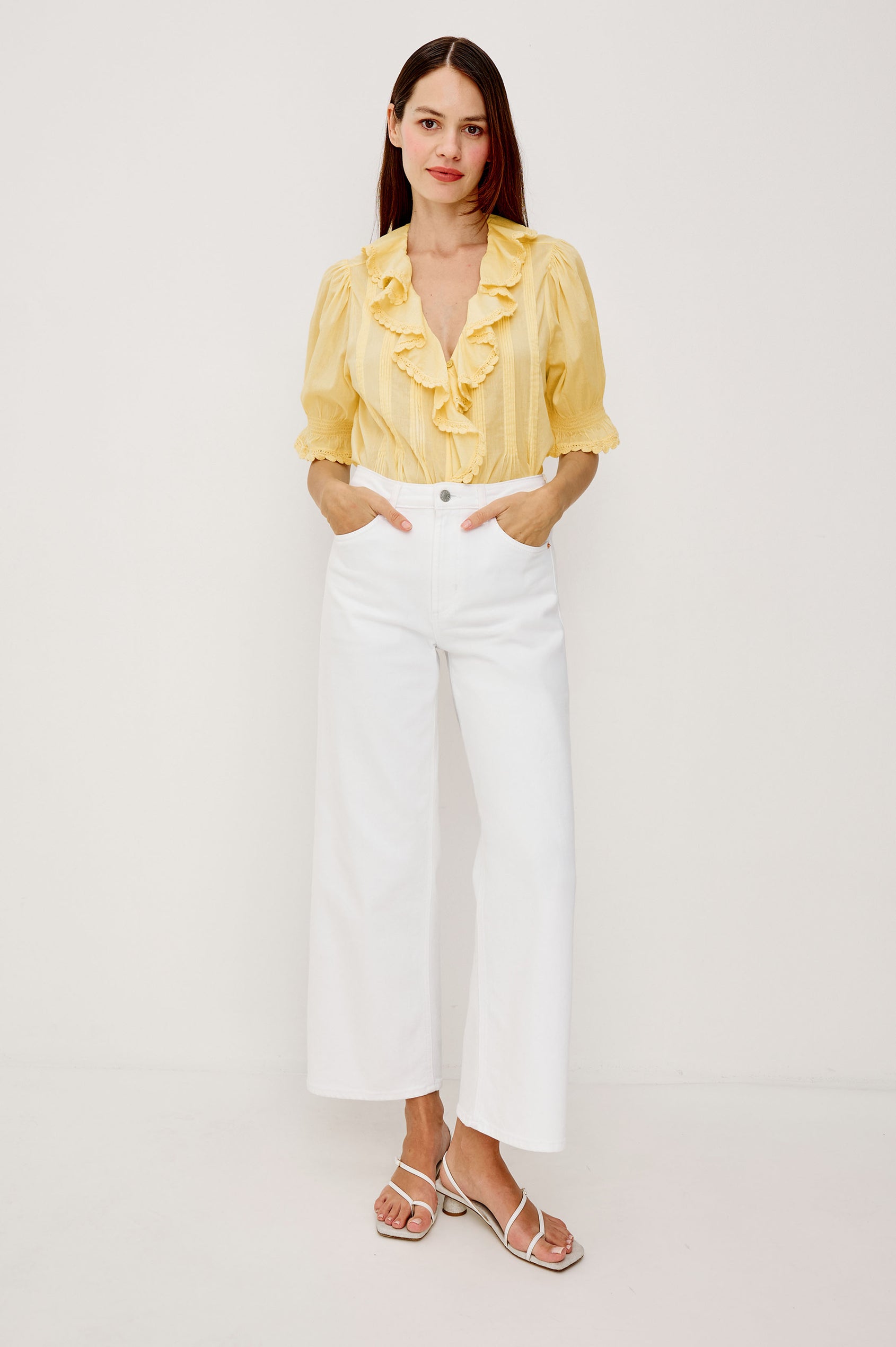 Bloom Poplin Top With Ruffle V-Neckline Elbow-Length Puff Sleeves With Ruffled Cuffs Pintuck Detailing and Boxy Relaxed Fit in Sunshine Colorway - Upper Body Front View Featured on Model