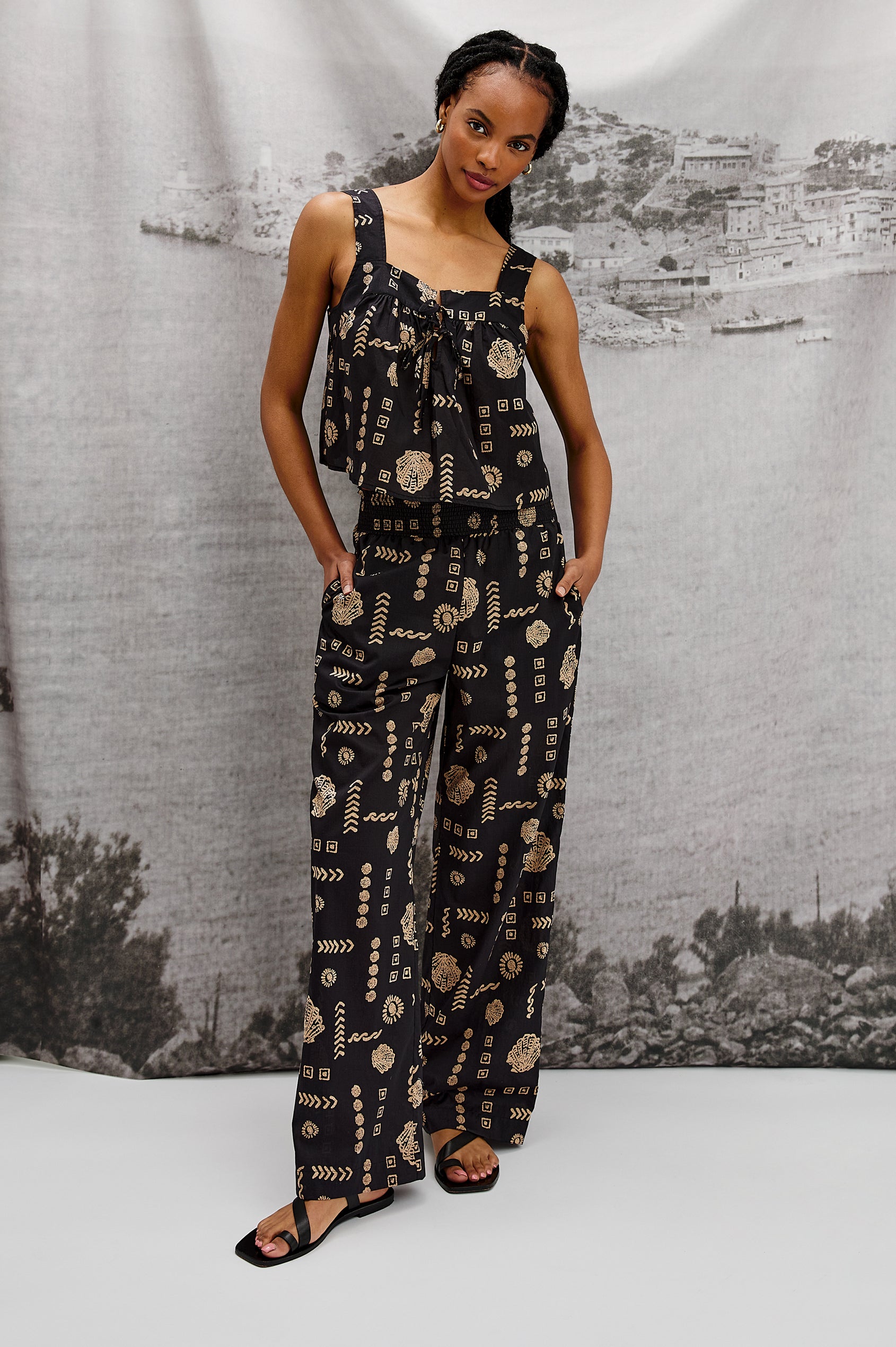 Blythe Square Neck Tank Top with Wide Straps and Two Front Ties in Beach Shells Colorway. Stylized full body front view on Model.