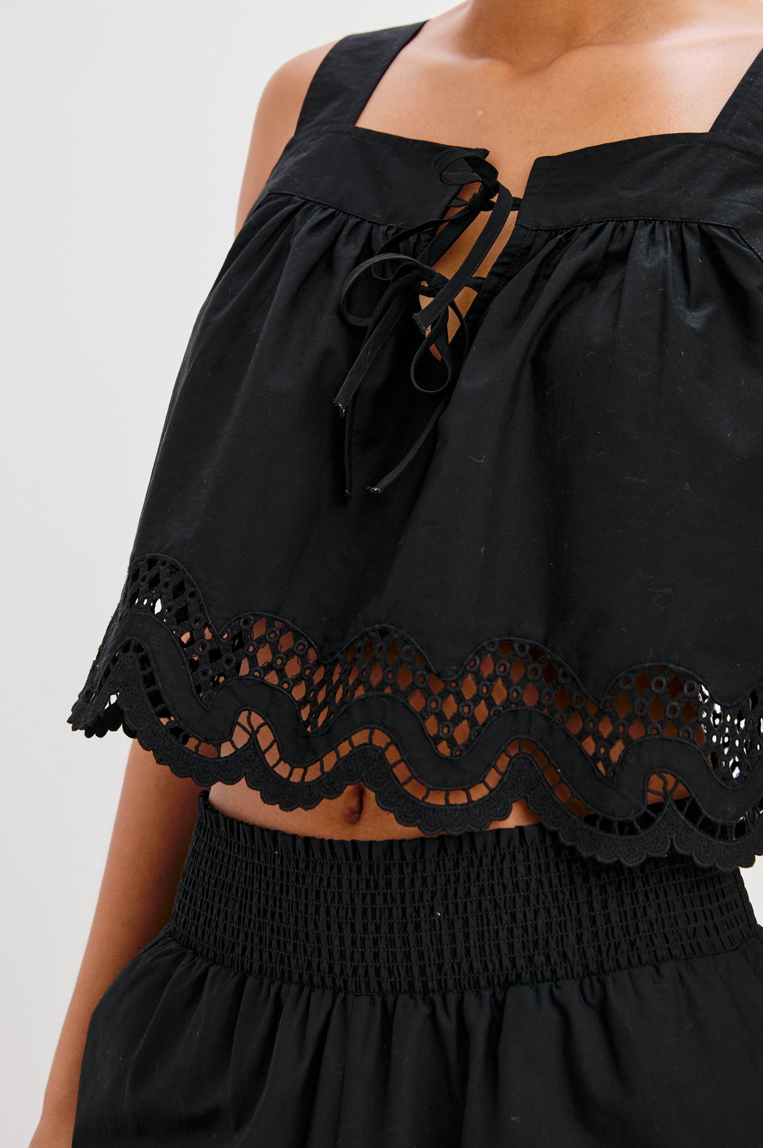 Blythe Square Neck Tank with Wide Straps, Two Front Ties and a Scalloped Hem in Black Colorway. Front Detailed View Shown on Model.