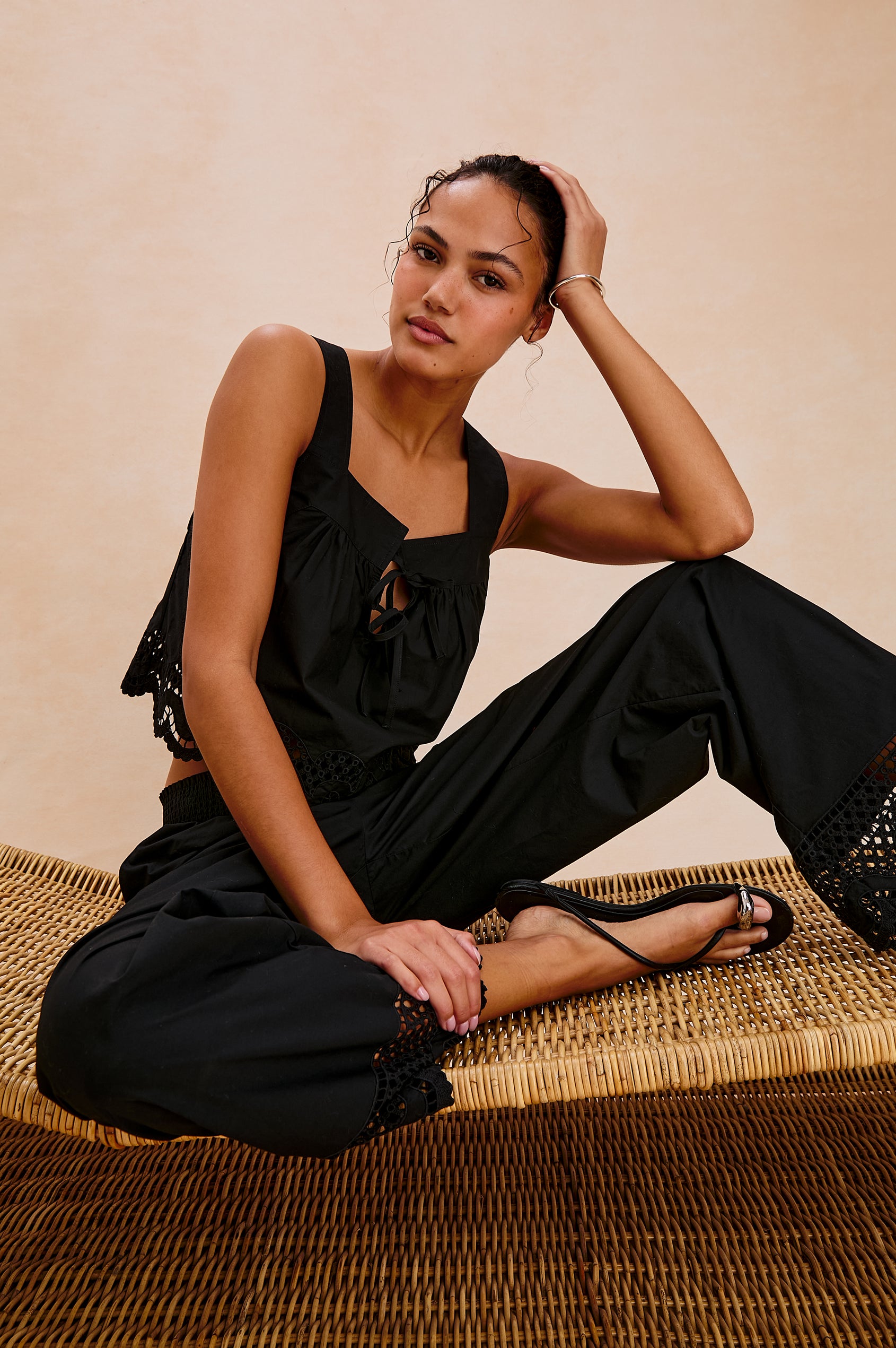 Blythe Square Neck Tank with Wide Straps, Two Front Ties and a Scalloped Hem in Black Colorway. Front View Shown on Model.