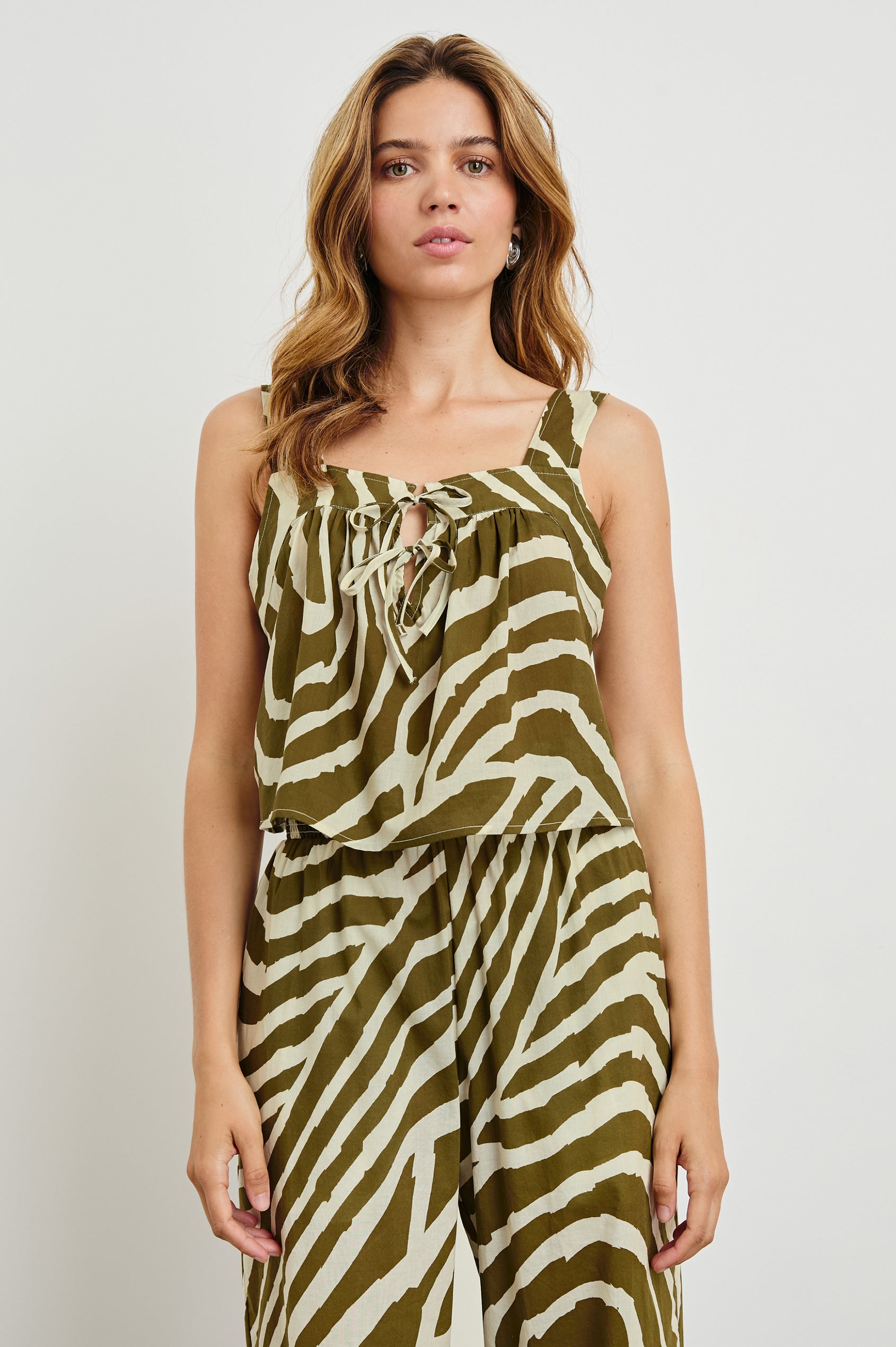 Blythe Crop Tank Top with a Deep Neck with Ties in Selva Colorway, an Olive and White Print - Front View Featured on Model 