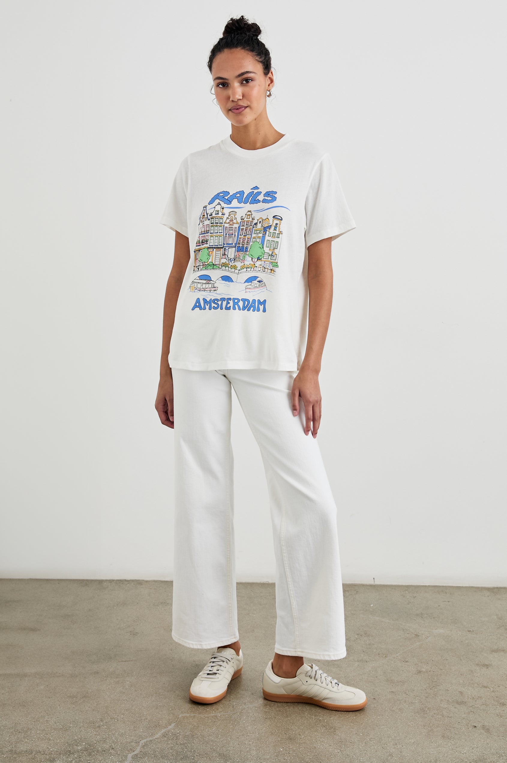 Boyfriend T-Shirt with a Crew Neck, Amsterdam images, and the text, Rails Amsterdam in Rails Amsterdam Colorway, with image and text in blues, browns, greens, on White - Front Full Body View Featured on Model
