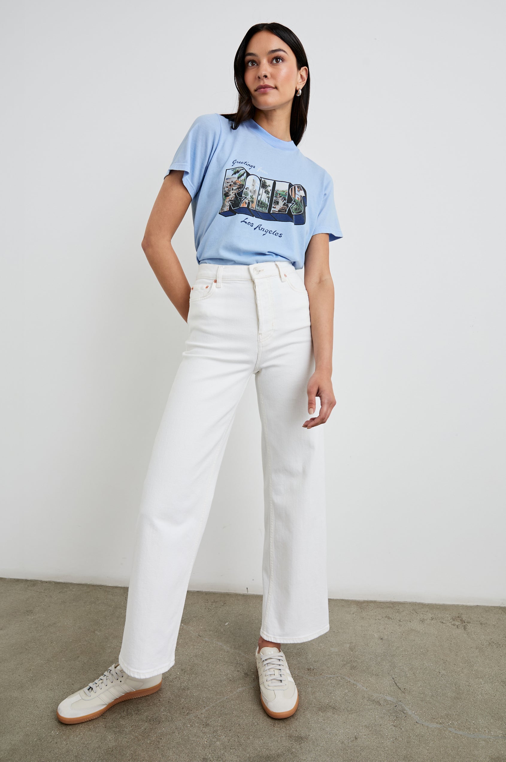 Boyfriend T-Shirt with a Crew Neck, photographs of Los Angeles and the text, Greetings From Rails Los Angeles in Rails Los Angeles Blue Colorway, with text in Blue and White - Front Tucked Full Body View Featured on Model