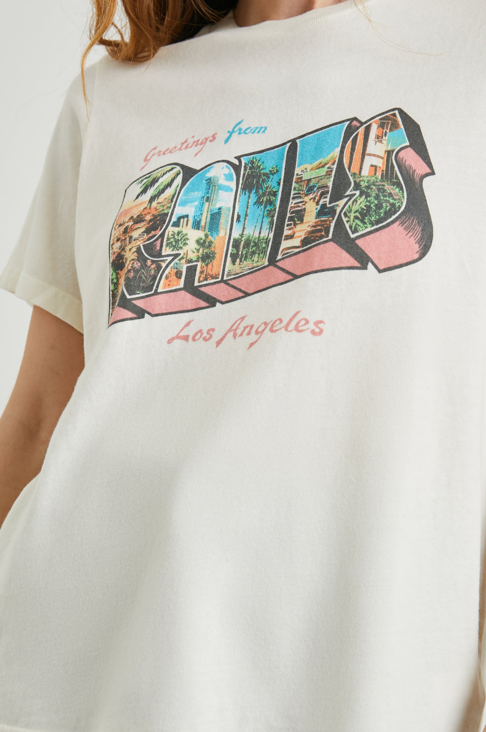 Boyfriend T-Shirt with a Crew Neck, photographs of Los Angeles and the text, Greetings From Rails Los Angeles in Rails Los Angeles Ecru Colorway, with text in Pink and Blue - Front View Featured on Model