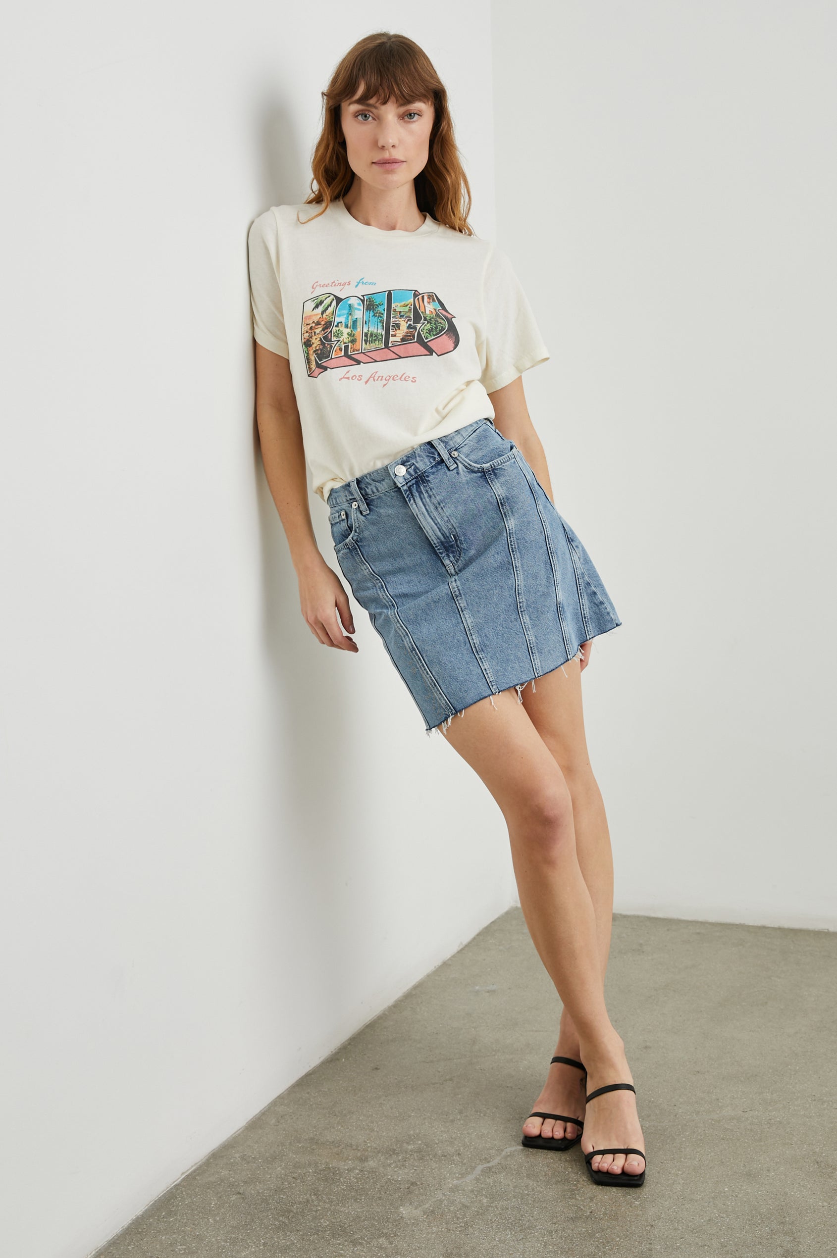 Boyfriend T-Shirt with a Crew Neck, photographs of Los Angeles and the text, Greetings From Rails Los Angeles in Rails Los Angeles Ecru Colorway, with text in Pink and Blue - Front Tucked Full Body View Featured on Model