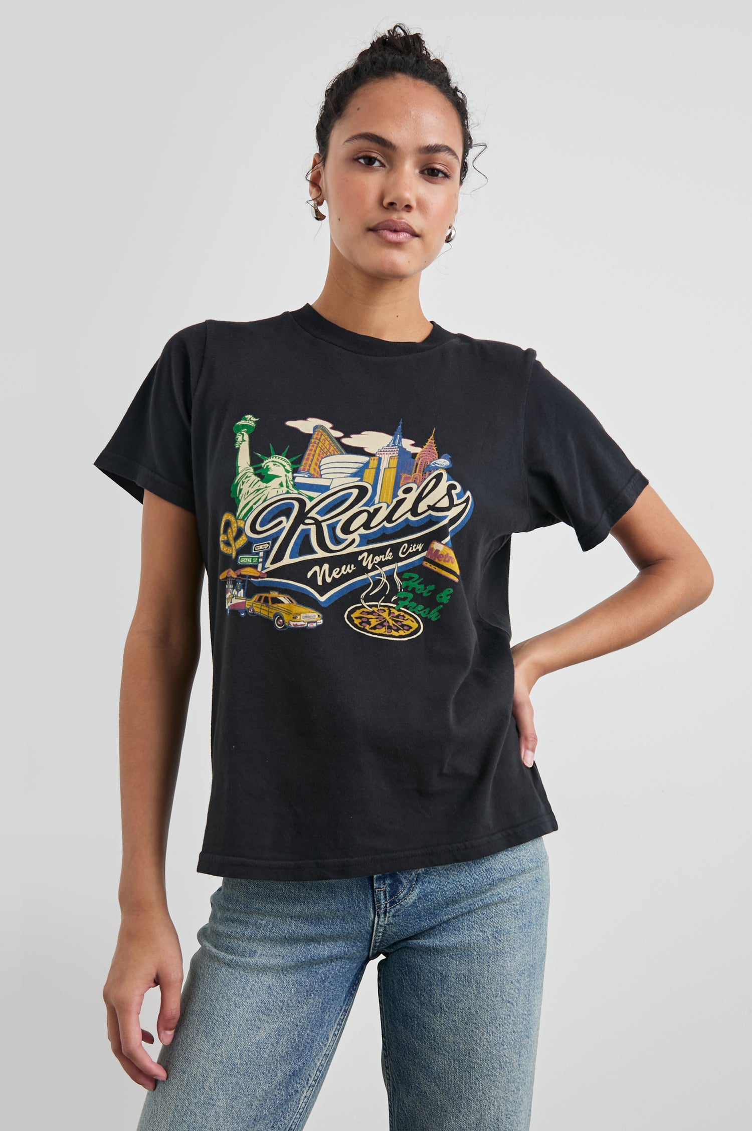 Boyfriend T-Shirt with a Crew Neck, New York images, and the text, Rails New York City, Hot and Fresh in Rails New York Colorway, with image and text in black browns, greens, pinks, white, blues on Black - Front View Featured on Model