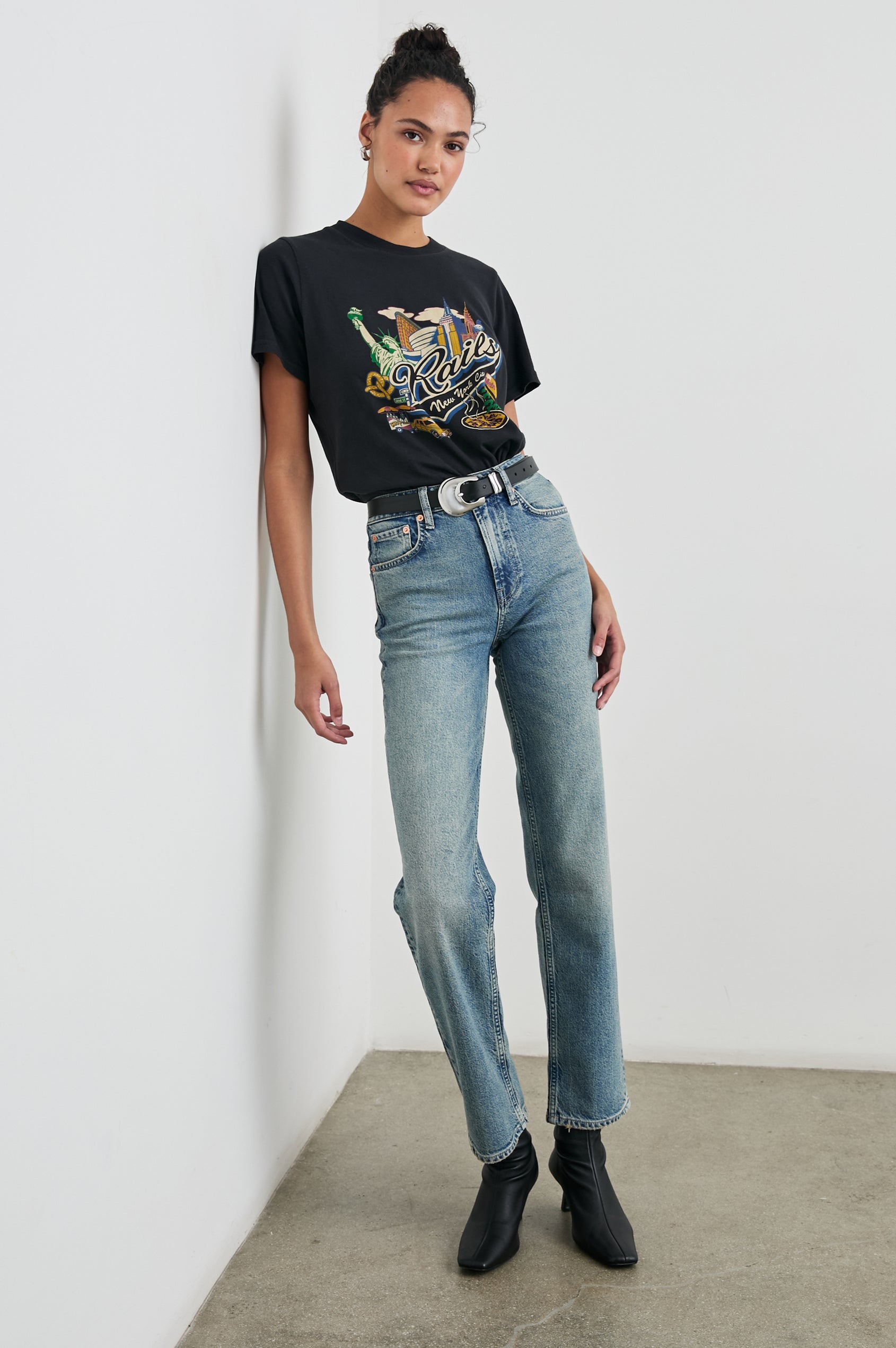 Boyfriend T-Shirt with a Crew Neck, New York images, and the text, Rails New York City, Hot and Fresh in Rails New York Colorway, with image and text in black browns, greens, pinks, white, blues on Black - Front Tucked Full Body View Featured on Model