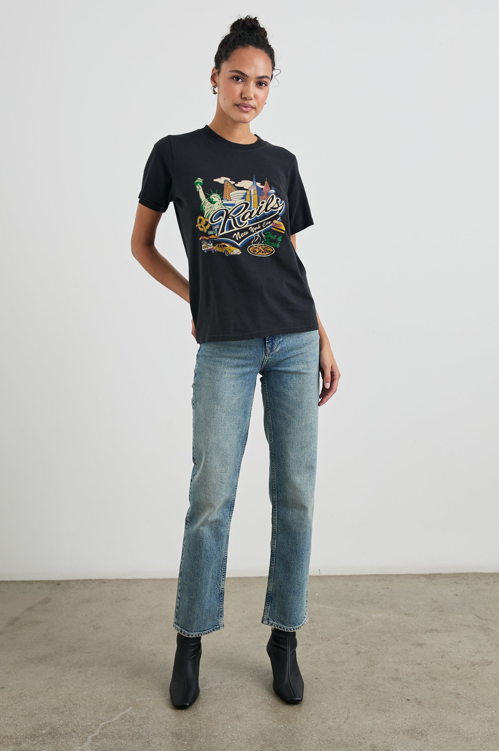 Boyfriend T-Shirt with a Crew Neck, New York images, and the text, Rails New York City, Hot and Fresh in Rails New York Colorway, with image and text in black browns, greens, pinks, white, blues on Black - Front Full Body View Featured on Model