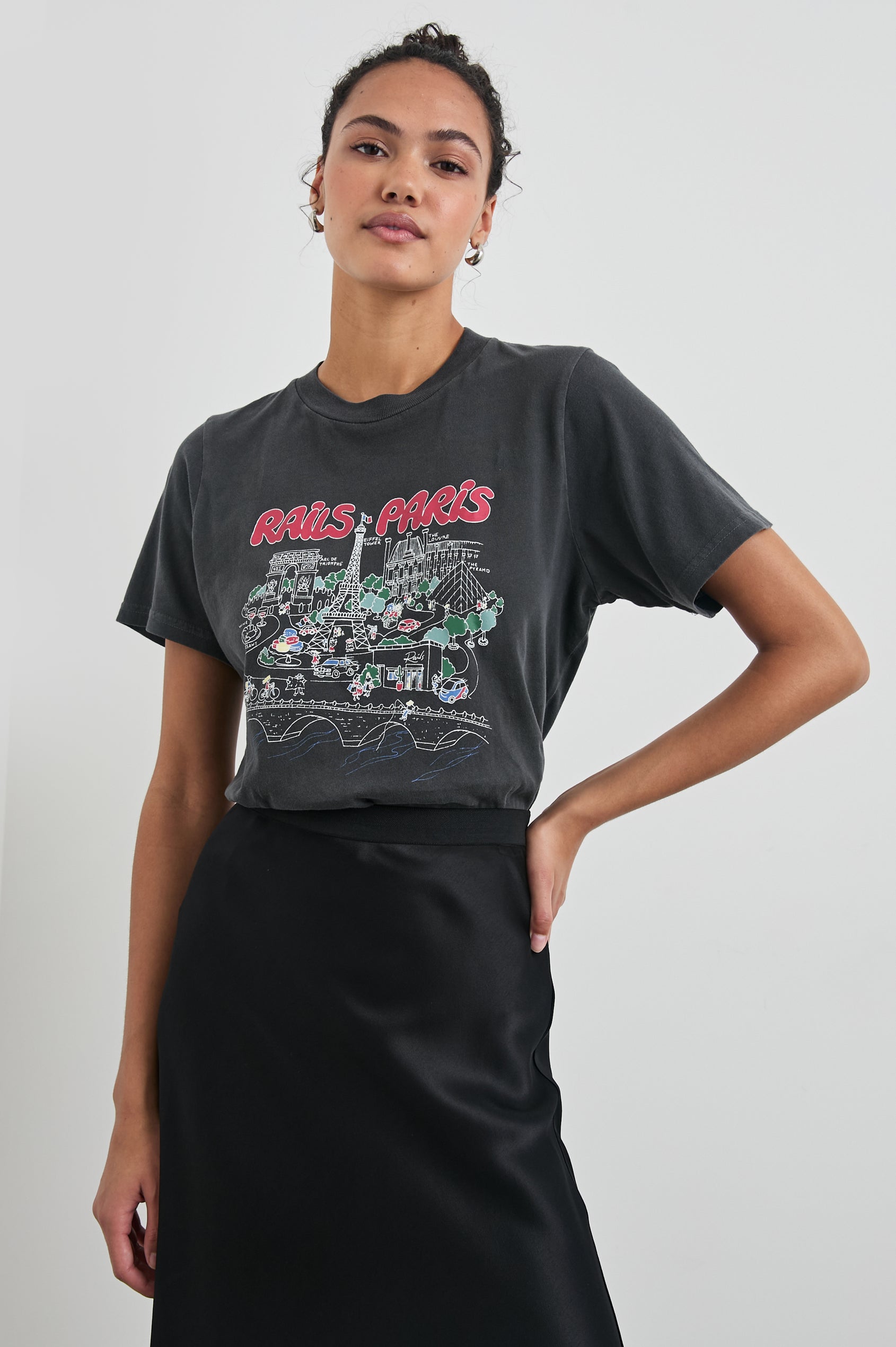 Boyfriend T-Shirt with a Crew Neck, Paris Images and the text, Rails Paris in Rails Paris Colorway, with text and images in mostly Pink and white on Black - Front View Featured on Model