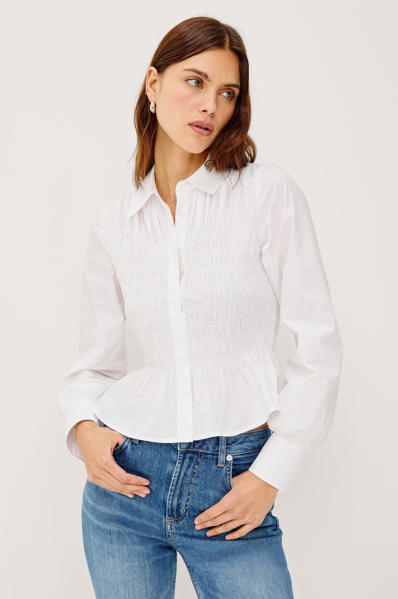 Bradshaw Button-Up Shirt in Cotton Poplin With Collar, Smocked Body, Peplum Hem, and Long Gathered Sleeves in White Colorway - Upper Body Front View Featured on Model