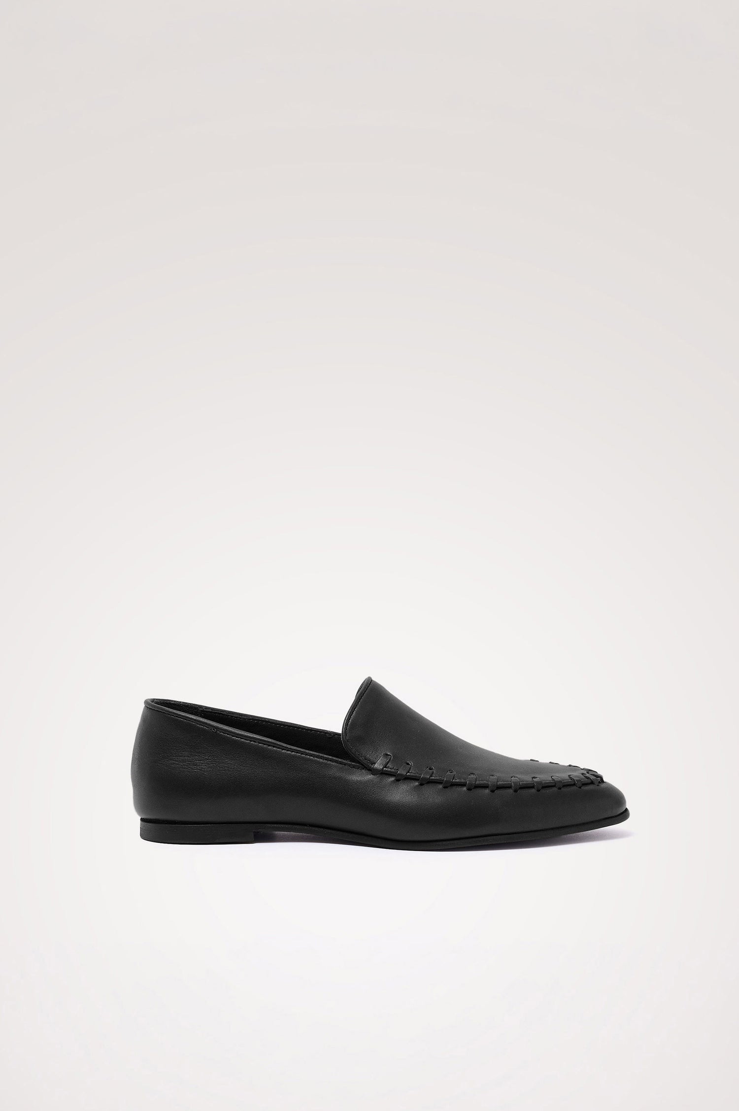 Braga Loafer in Full-Grain Leather With Whipstitch Trim, Narrow Vamp, and Low Heel in Black Colorway - Side Product View Featured