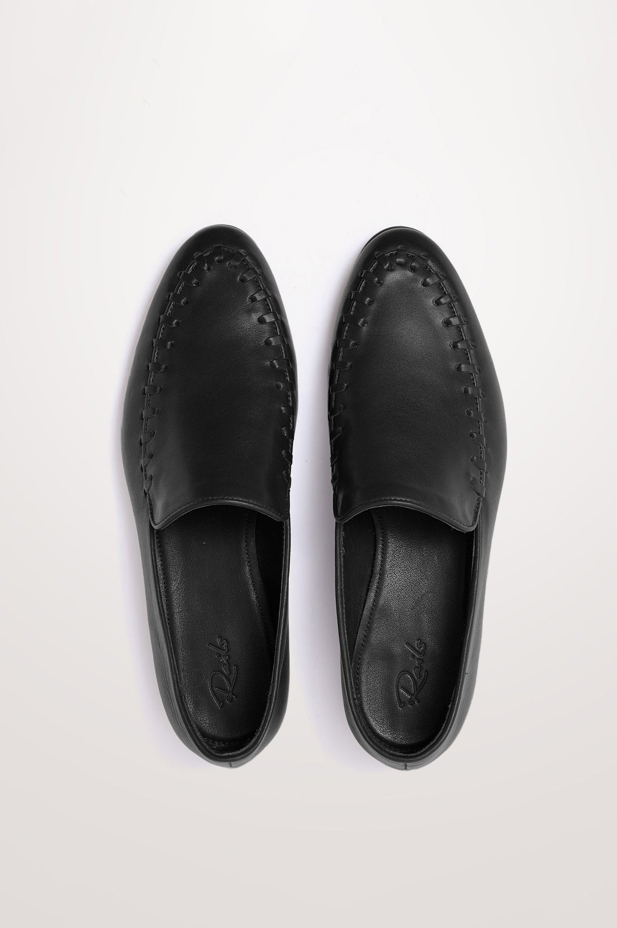 Braga Loafer in Full-Grain Leather With Whipstitch Trim, Narrow Vamp, and Low Heel in Black Colorway - Top Product View Featured