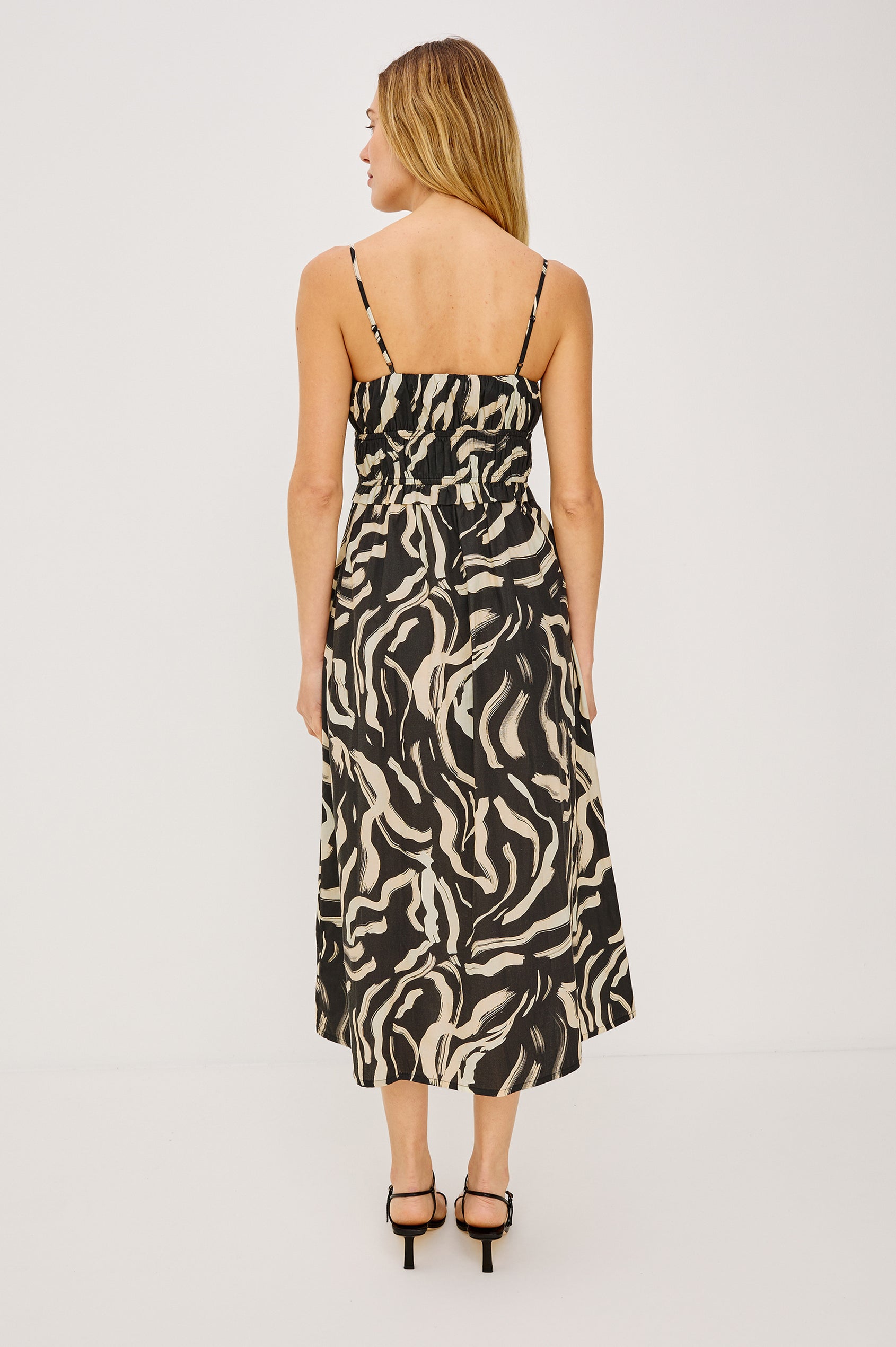 Breeze Midi Dress in Cotton Poplin With Adjustable Spaghetti Shoulder Straps, Gathered Bust, Smocked Waist, Side Pockets, and Full Skirt in Caicos Colorway - Full Body Back View Featured on Model