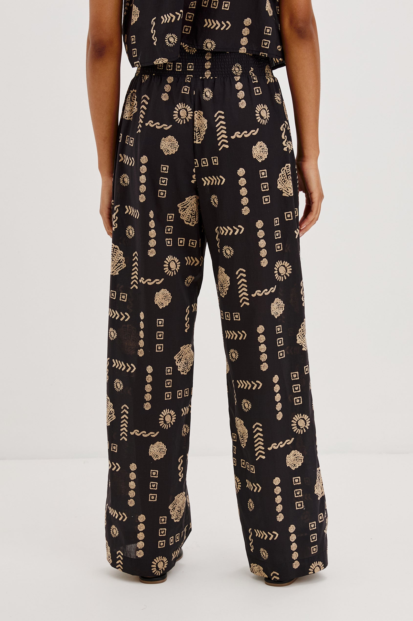 Brendon Pull on Pants with Wide Elastic Gathered Waistband, Relaxed fit and Side Slash Pockets in Beach Shells Colorway. Back View Shown on Model.