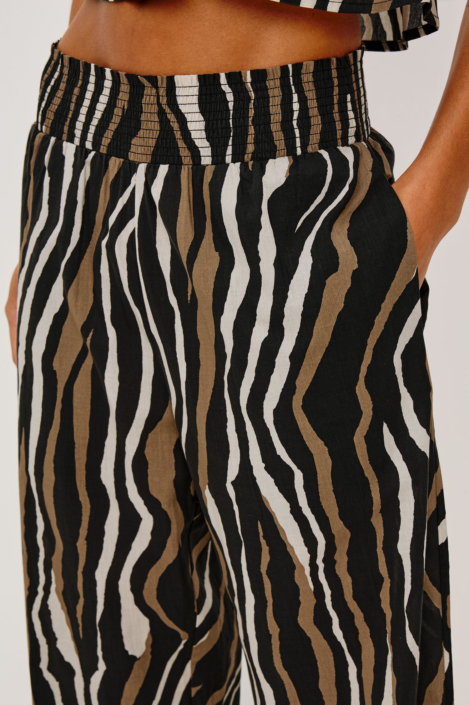 Brendon High-Rise High-Waisted Pant in Beach Cotton With Wide Legs and Smocked Waistband in Canyon Stripe Colorway - Lower Body Close Up View Featured on Model