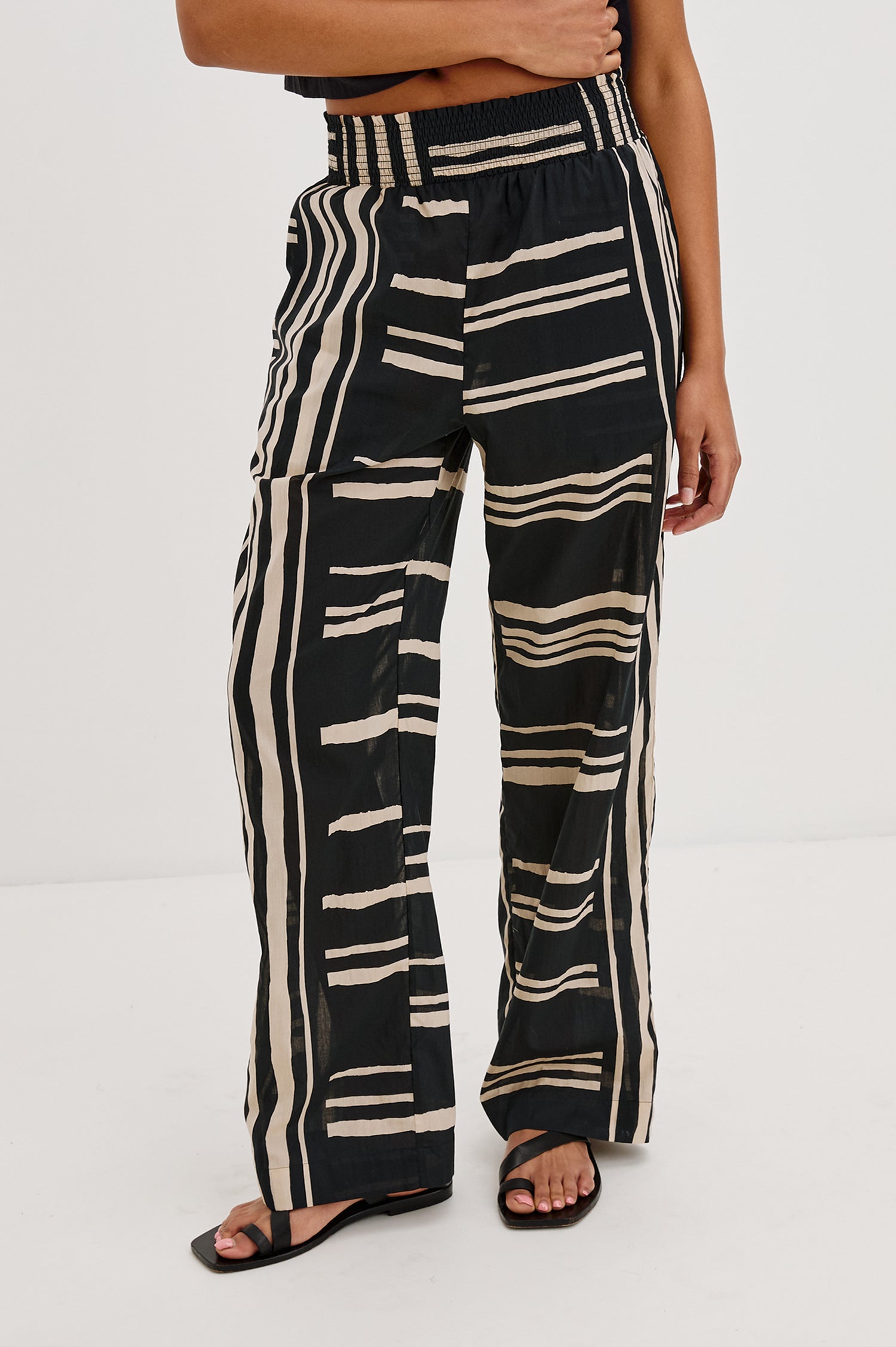 Brendon high-rise Pant with Elastic Waist and two front pockets in Island Stripe Colorway, with white vertical and horizontal stripes on black - Front View Featured on Model