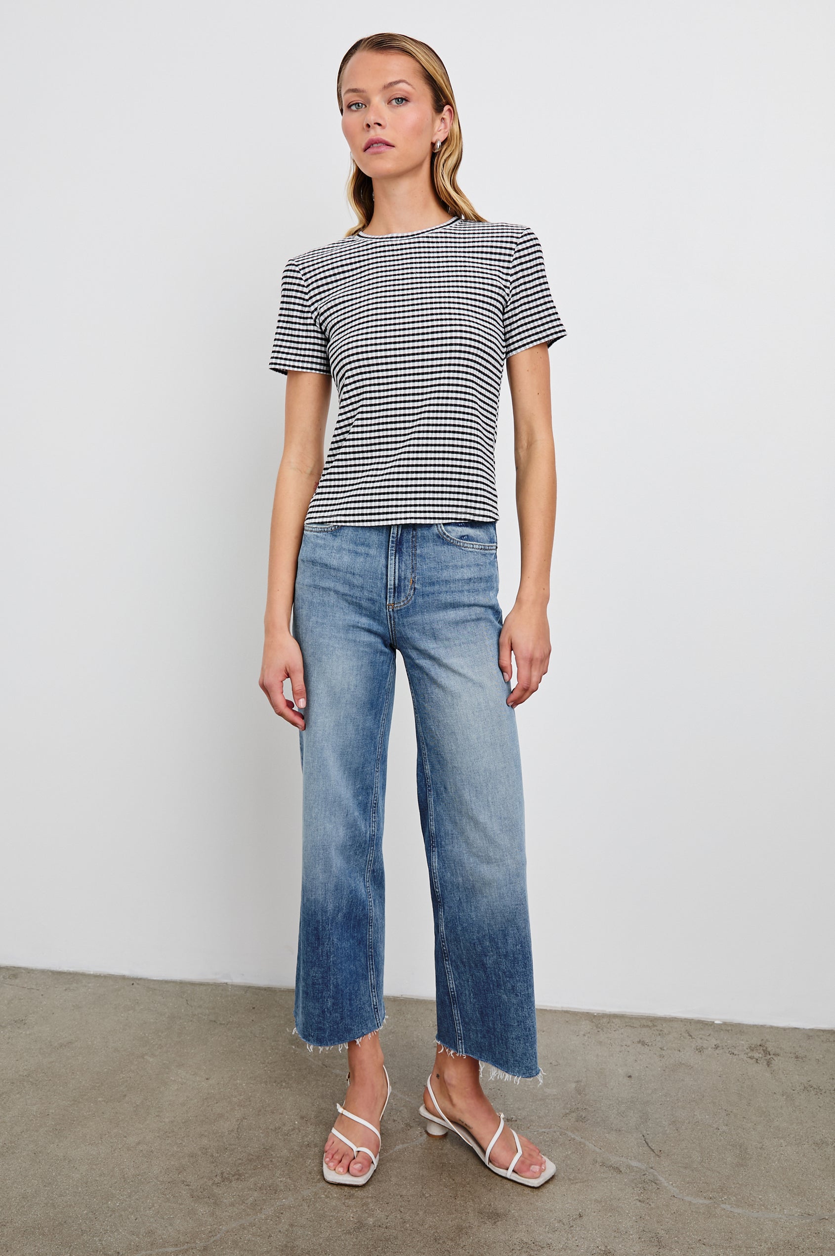 Britty Short-Sleeve Top with Crewneck in Black Gingham Colorway - Front Full Body View Featured on Model