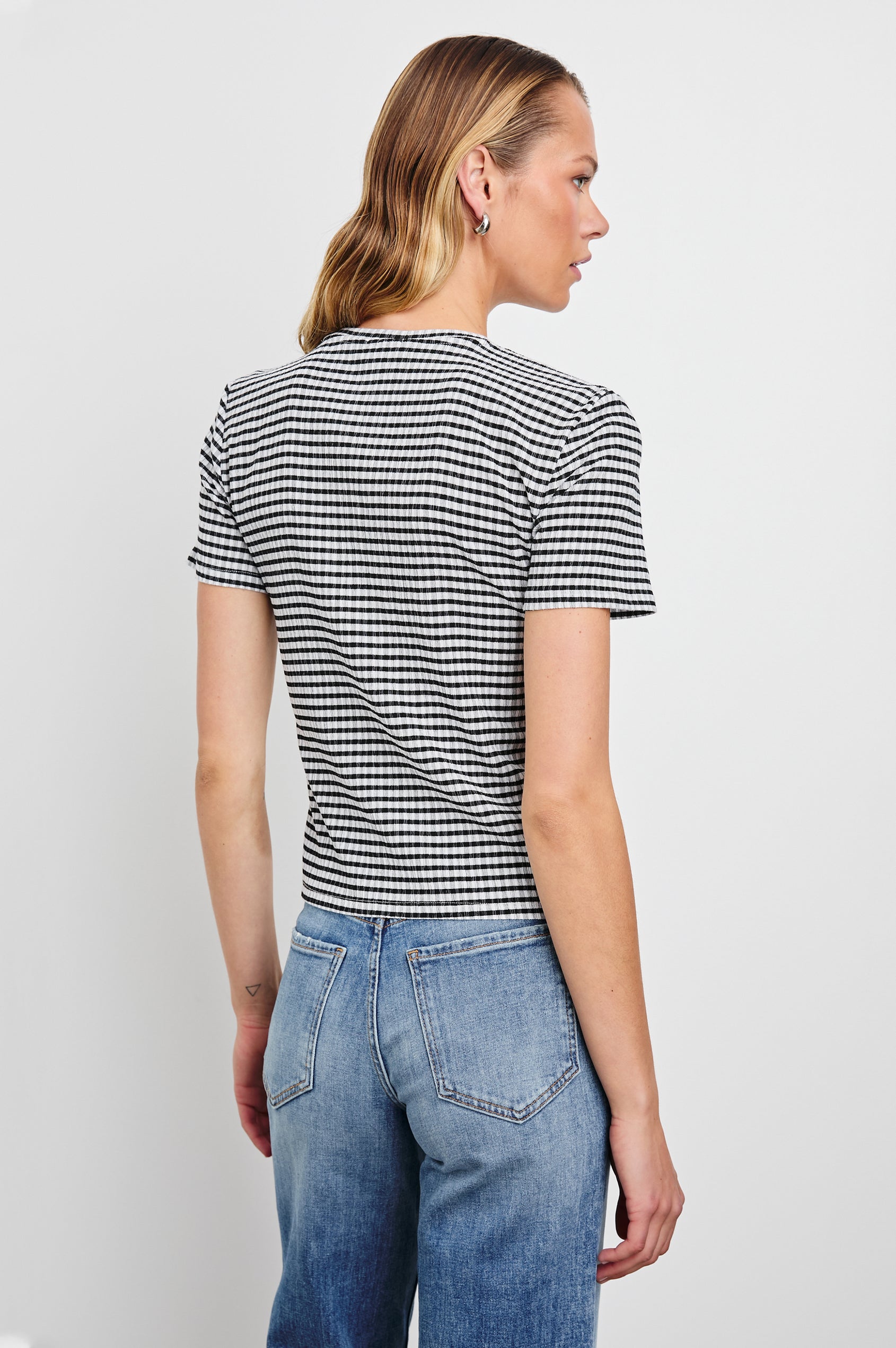 Britty Short-Sleeve Top with Crewneck in Black Gingham Colorway - Back View Featured on Model