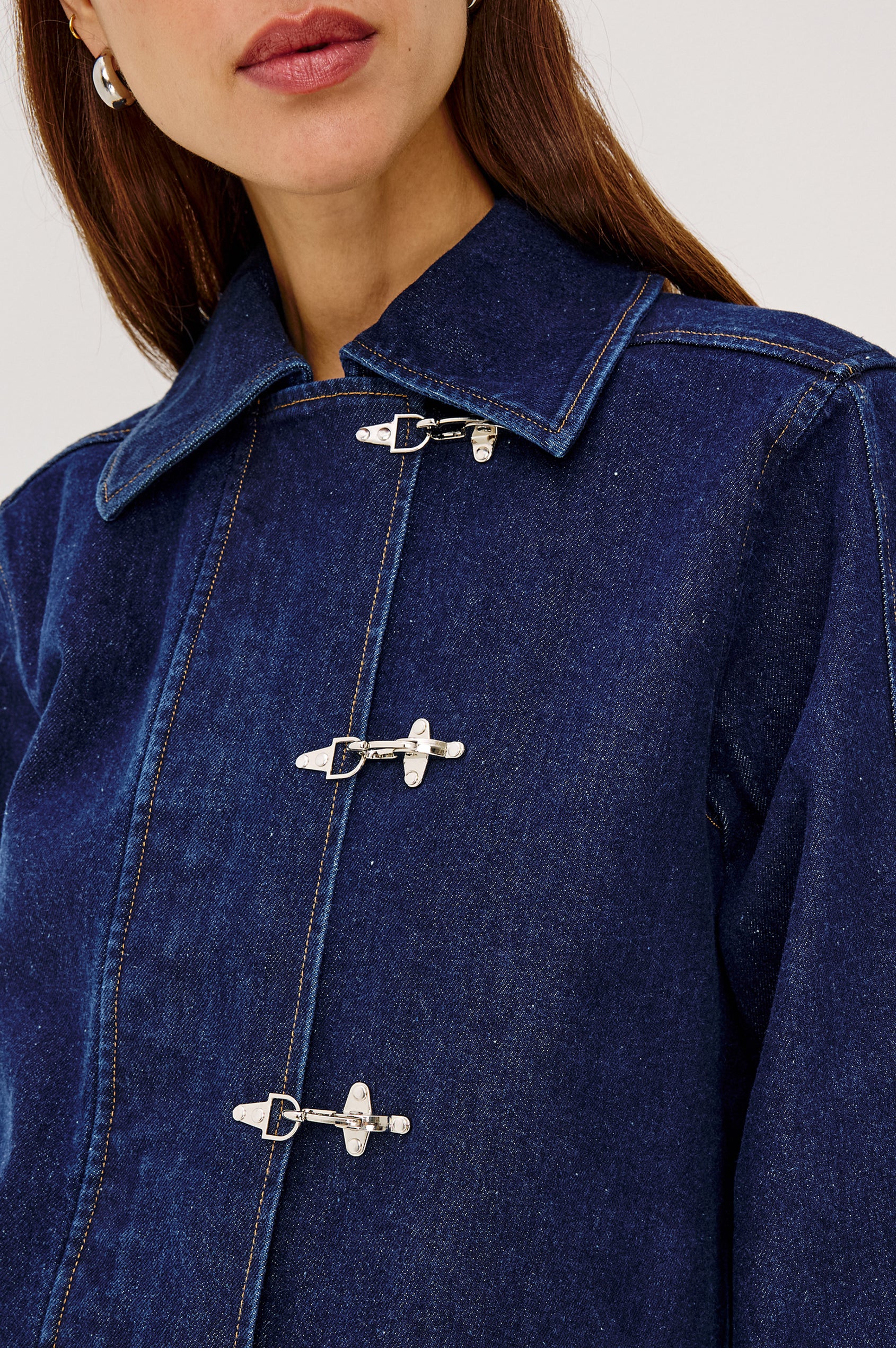 Brooke Jacket in Midweight Denim With Duffel Slightly Cropped Fit, Long Balloon Sleeves, Elastic Cuffs, Back Yoke Pleat, and Front Toggle Closures in Rinse Indigo Colorway - Upper Body Front View Featured on Model