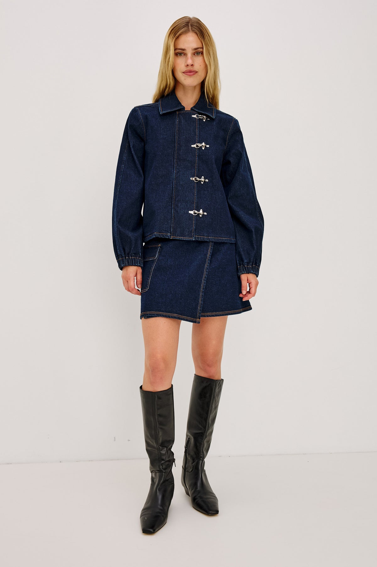 Brooke Jacket in Midweight Denim With Duffel Slightly Cropped Fit, Long Balloon Sleeves, Elastic Cuffs, Back Yoke Pleat, and Front Toggle Closures in Rinse Indigo Colorway - Full Body Front View Featured on Model