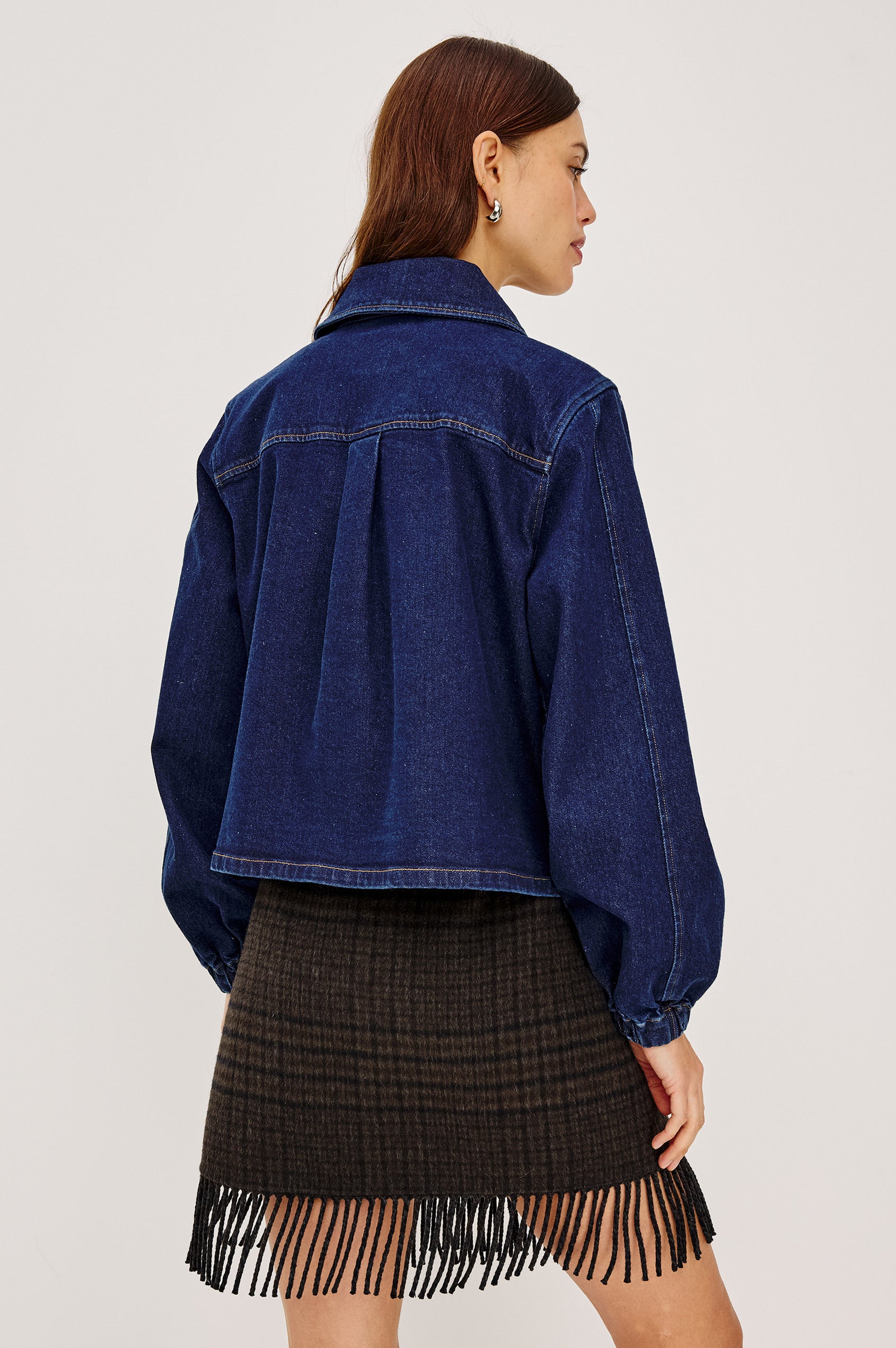 Brooke Jacket in Midweight Denim With Duffel Slightly Cropped Fit, Long Balloon Sleeves, Elastic Cuffs, Back Yoke Pleat, and Front Toggle Closures in Rinse Indigo Colorway - Upper Body Back View Featured on Model