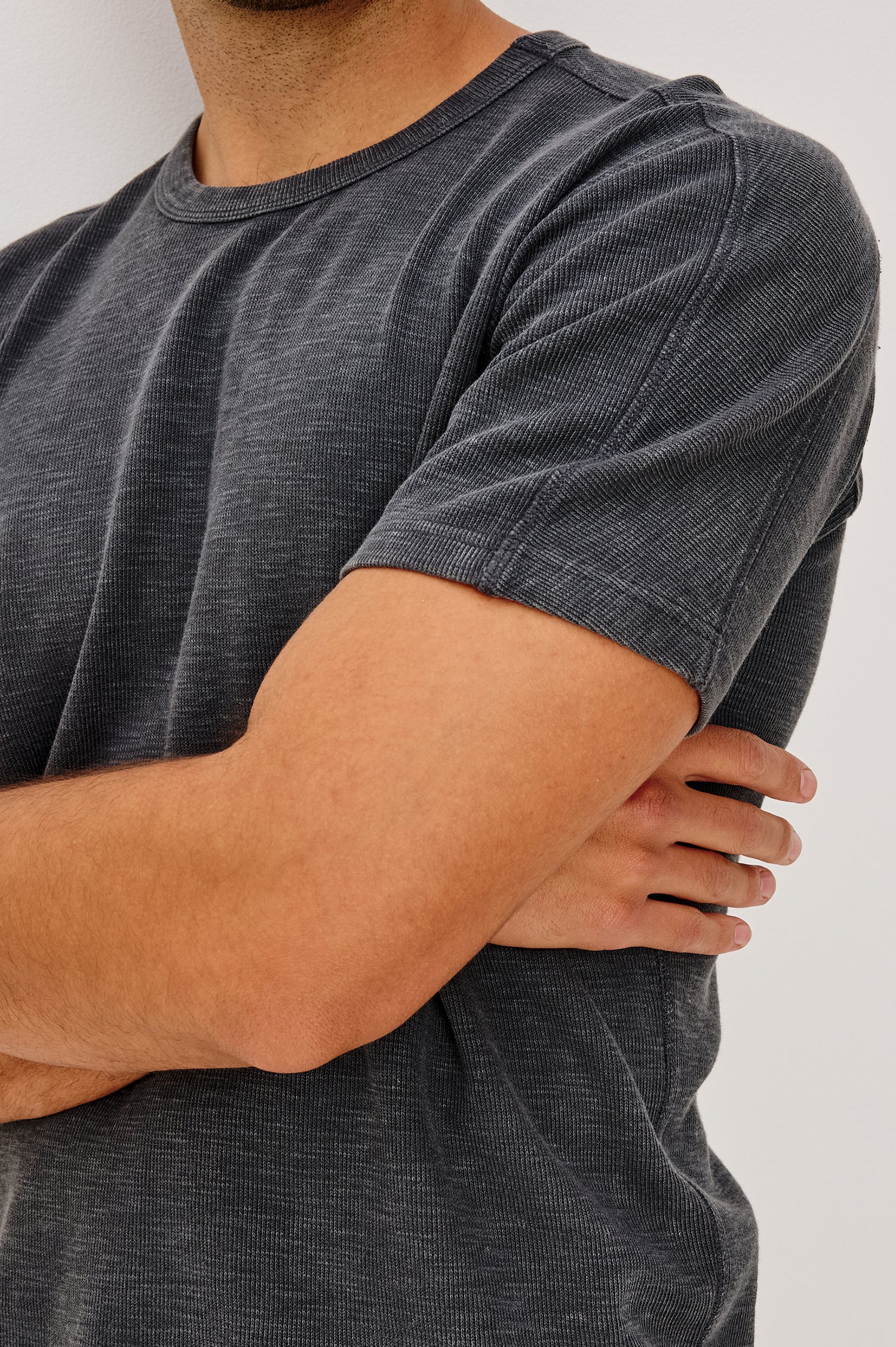 Brooks Short Sleeve T-Shirt With Crew Neckline, Short Sleeves, and Classic Fit in Washed Black Colorway - Upper Body Back View Featured on Model