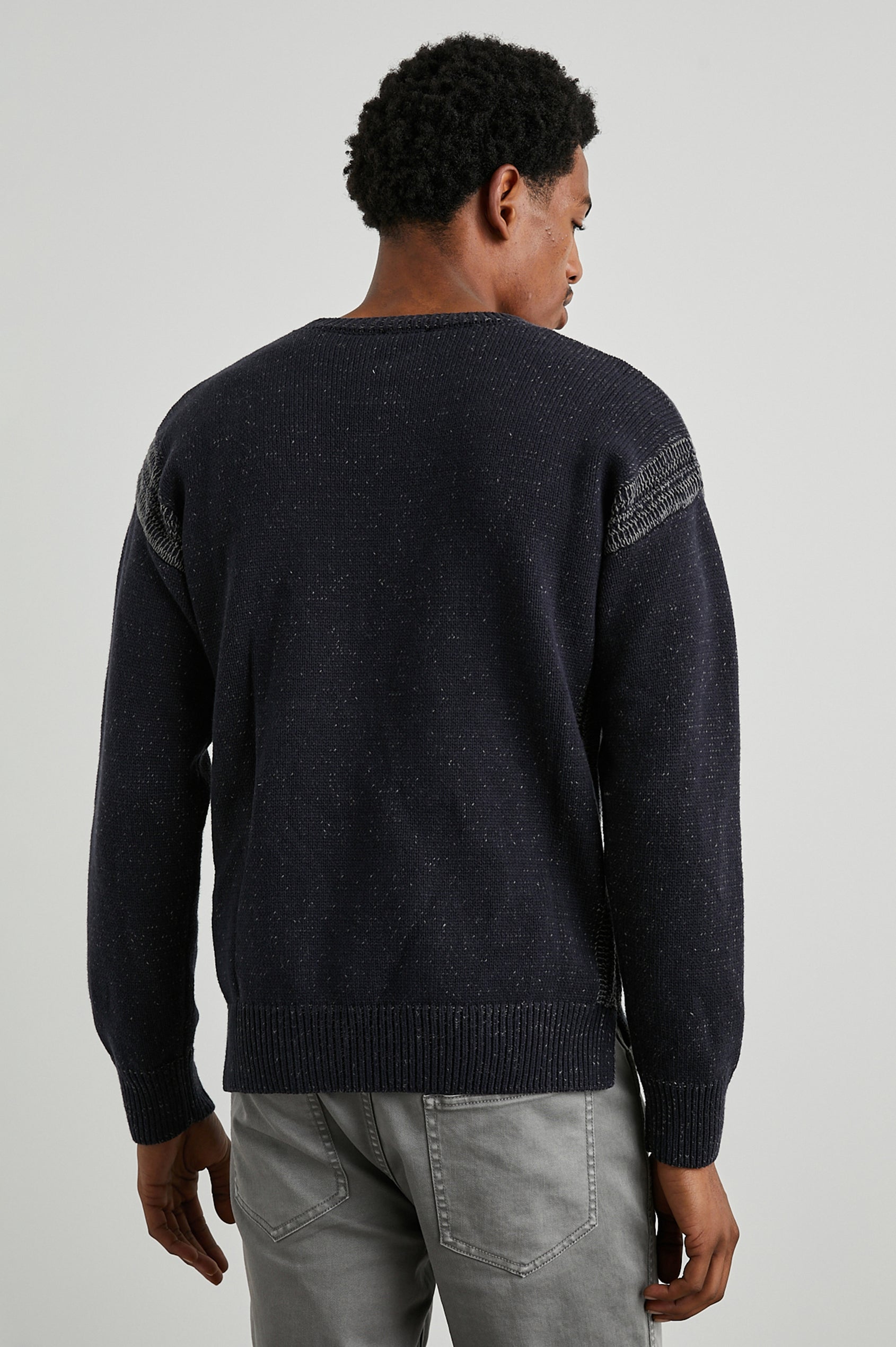 Bryce Long-Sleeve Sweater with a Crew Neck, Ribbed Trim in Navy Colorway, with White Speckles and Stitching at Shoulder Seams - Back View Featured on Model 