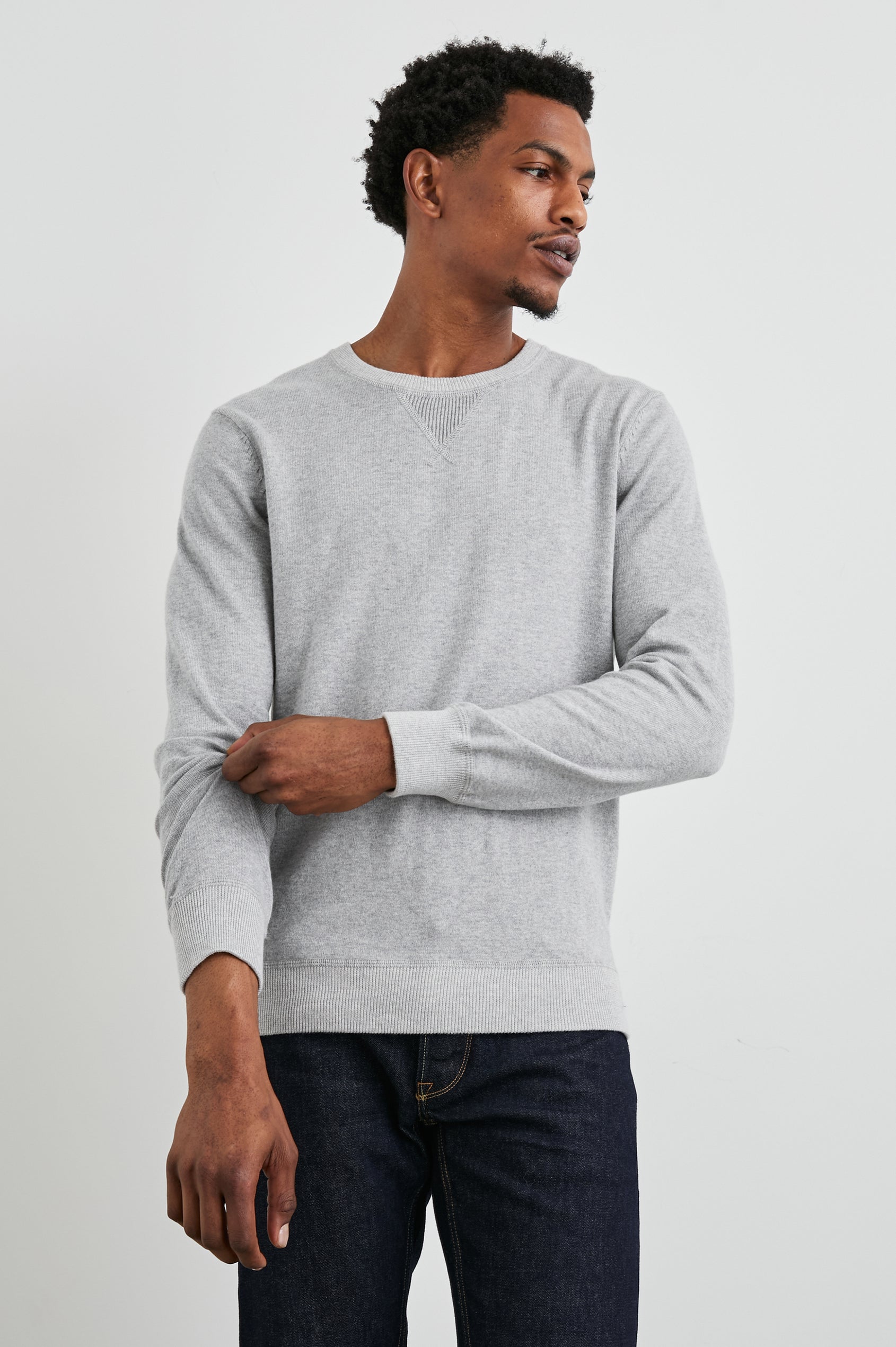 Burns Long-Sleeve Sweater with a Crew Collar and a Lighter Colored Ribbed Trim in Grey Heather Colorway - Front View Featured on Model