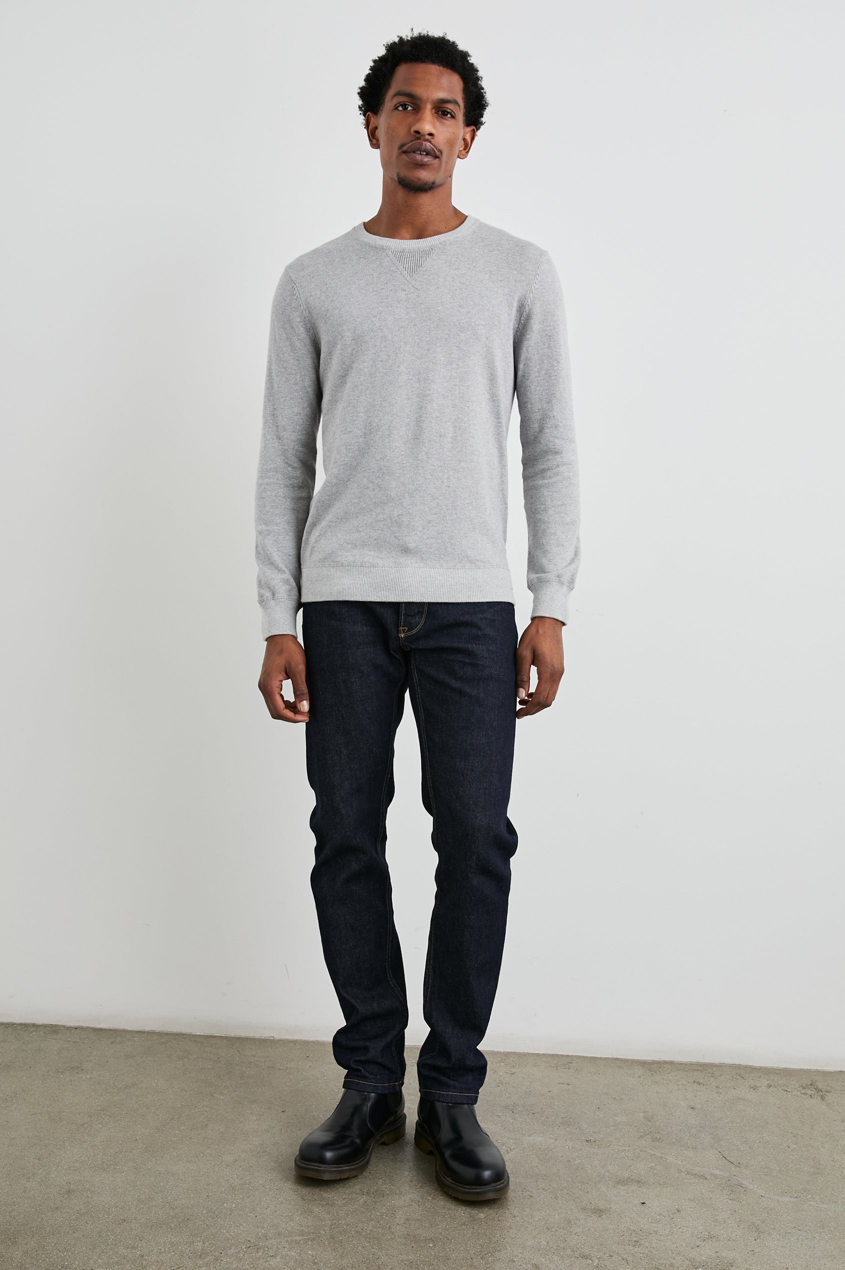 Burns Long-Sleeve Sweater with a Crew Collar and a Lighter Colored Ribbed Trim in Grey Heather Colorway - Front Full Body View Featured on Model