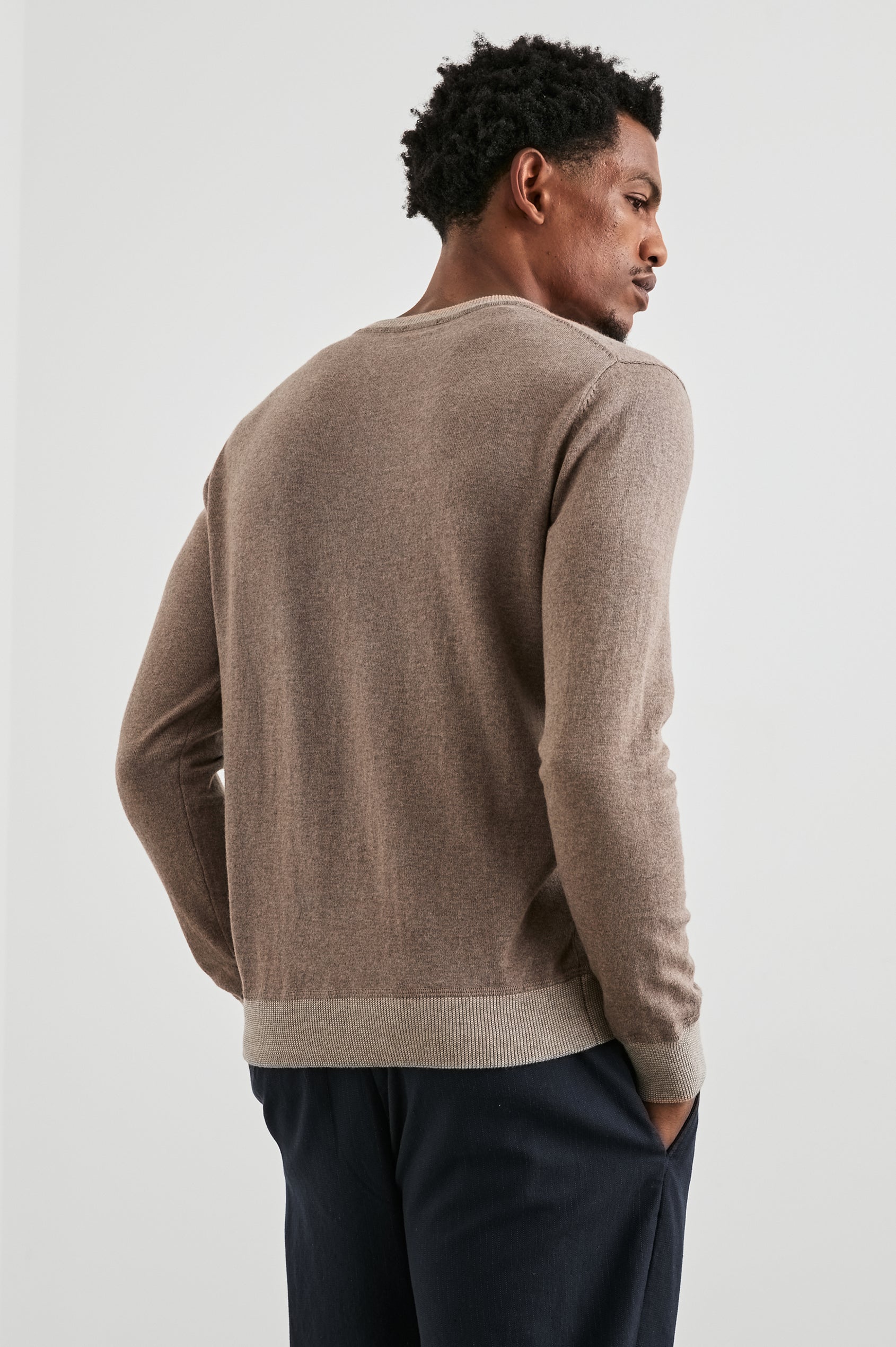 Burns Long-Sleeve Sweater with a Crew Collar and a Lighter Colored Ribbed Trim in Mocha Heather Colorway - Back View Featured on Model