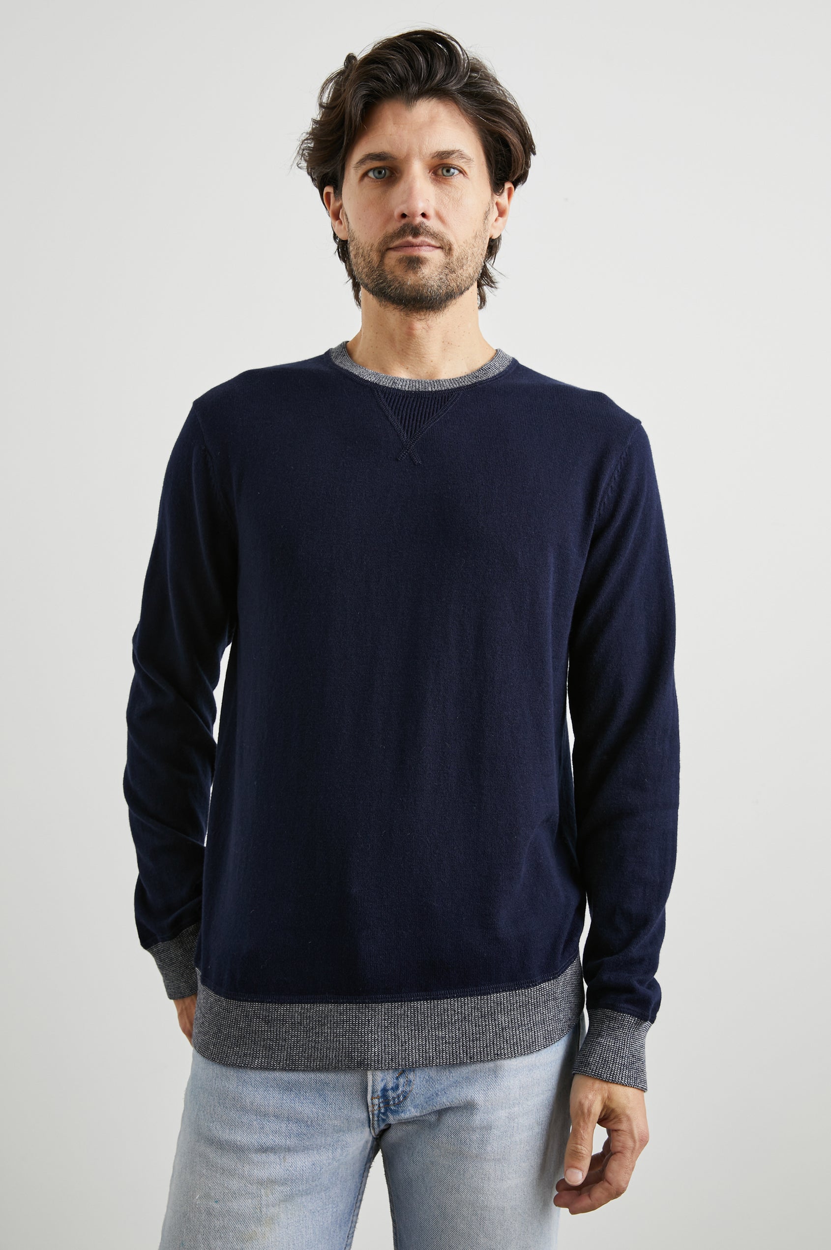 Burns Long-Sleeve Sweater with a Crew Collar and a Lighter Colored Ribbed Trim in Perfect Navy Colorway - Front View Featured on Model