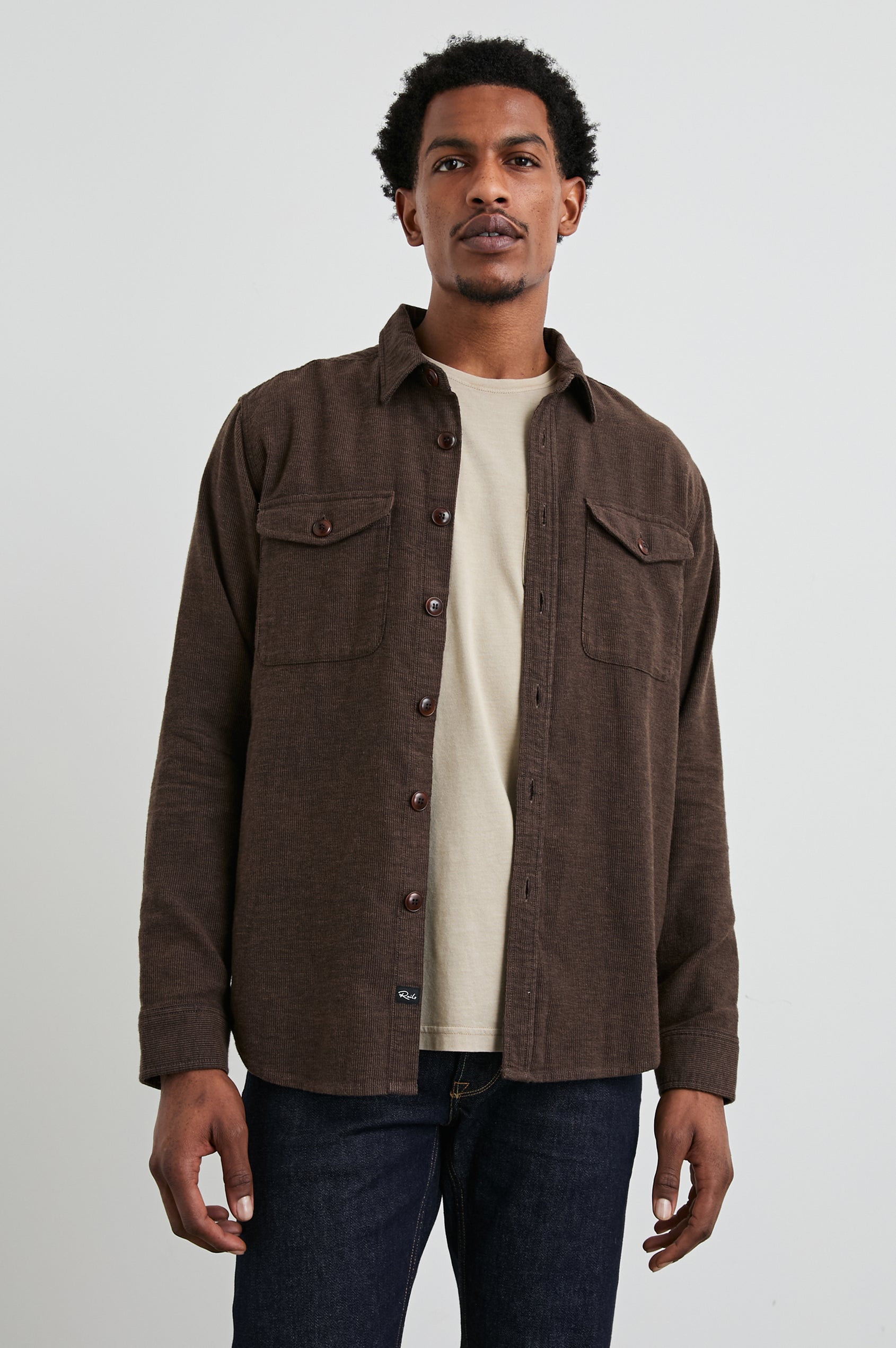 Burr Collared Shirt Jacket with Button Closure, Two Chest Button Flap Pockets and Textured Fabric in Pine Cone Colorway, a Brown - Front Unbuttoned View Featured on Model