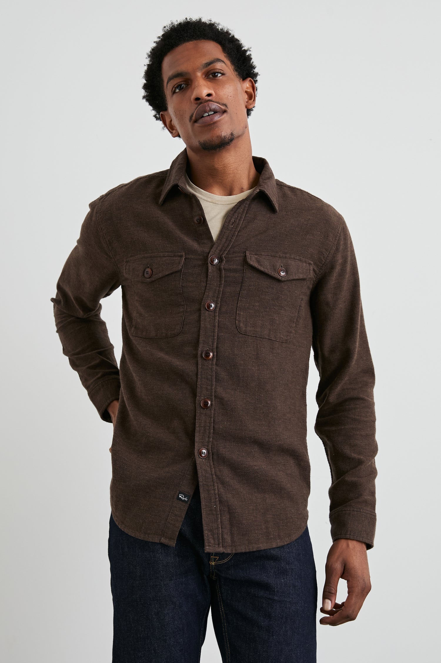 Burr Collared Shirt Jacket with Button Closure, Two Chest Button Flap Pockets and Textured Fabric in Pine Cone Colorway, a Brown - Front View Featured on Model