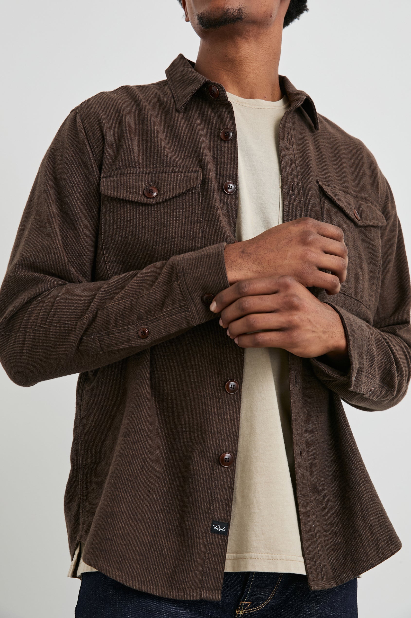 Burr Collared Shirt Jacket with Button Closure, Two Chest Button Flap Pockets and Textured Fabric in Pine Cone Colorway, a Brown - Front Unbuttoned View Featured on Model