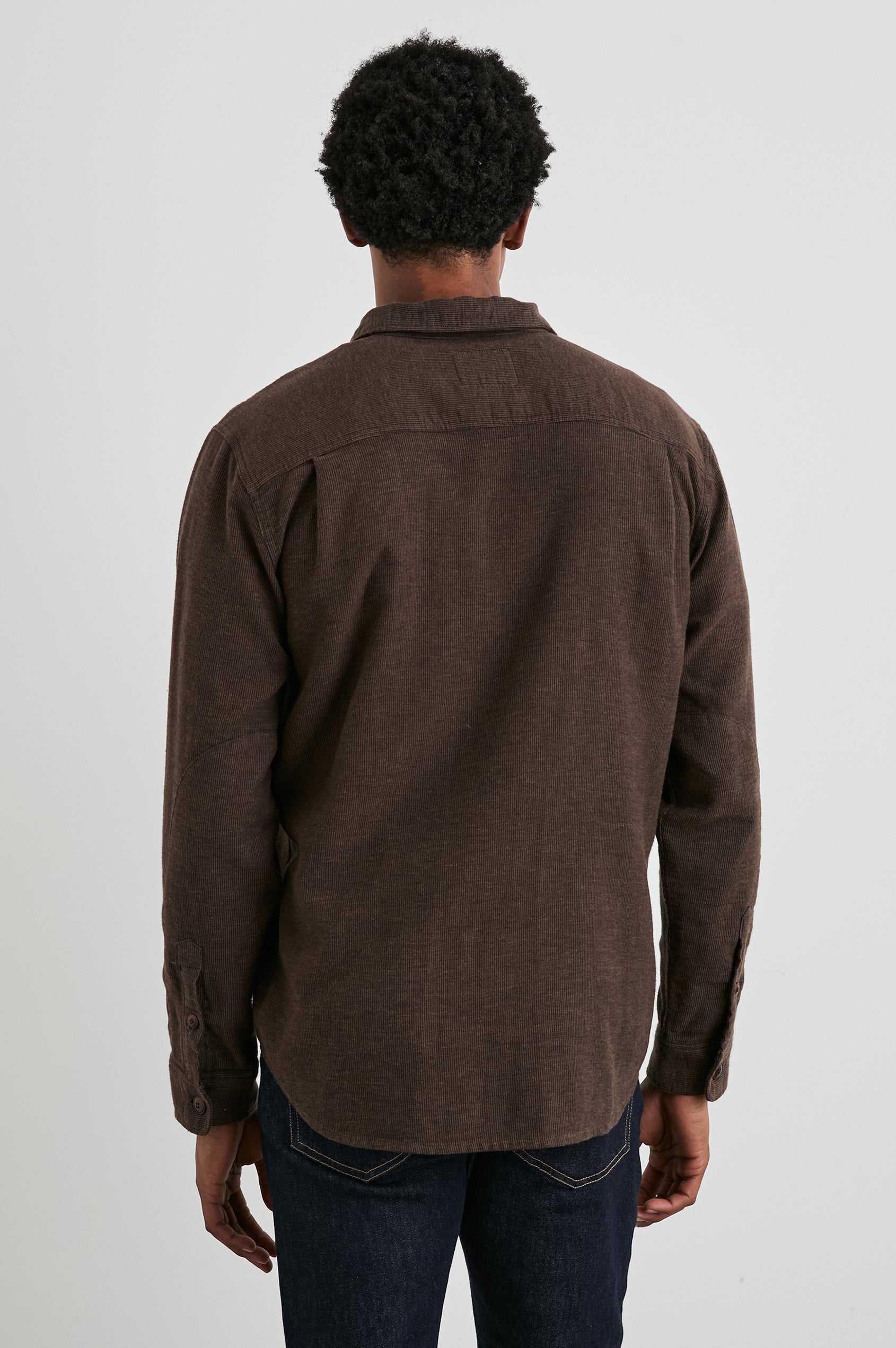 Burr Collared Shirt Jacket with Button Closure, Two Chest Button Flap Pockets and Textured Fabric in Pine Cone Colorway, a Brown - Back View Featured on Model